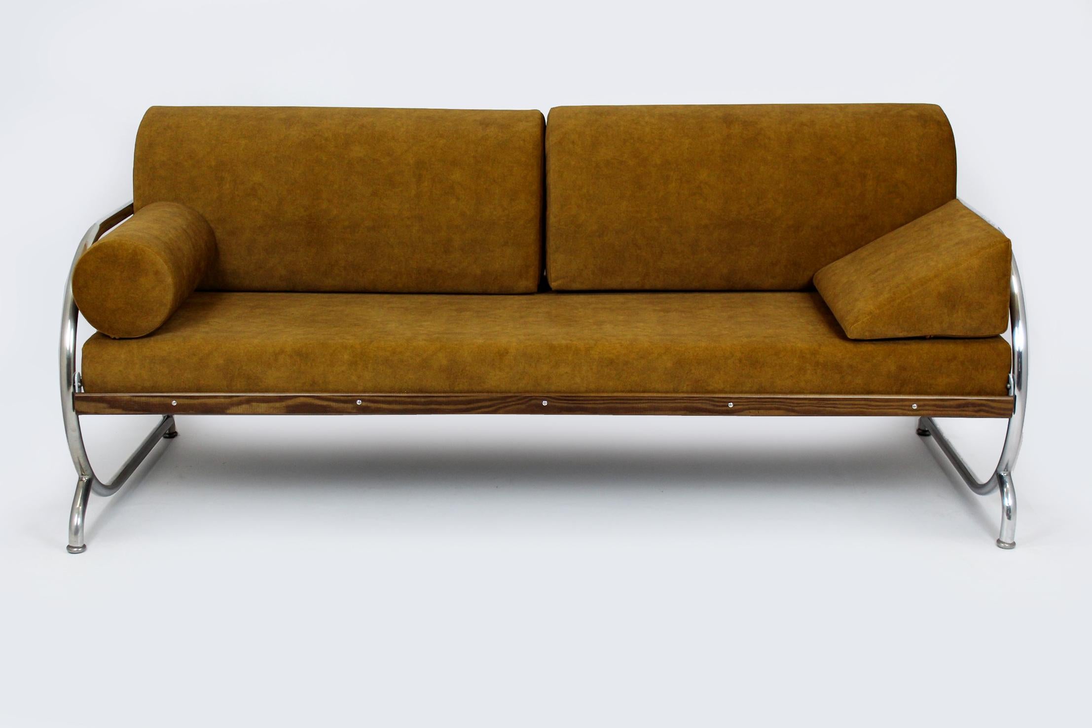 
This Bauhaus style sofa was produced by Hynek Gottwald in the 1930s. The sofa has been completely restored, it has brand new mattresses upholstered in easy-to-clean fabric. The woodwork has been lacquered, glossy finish. Chrome is in original, good