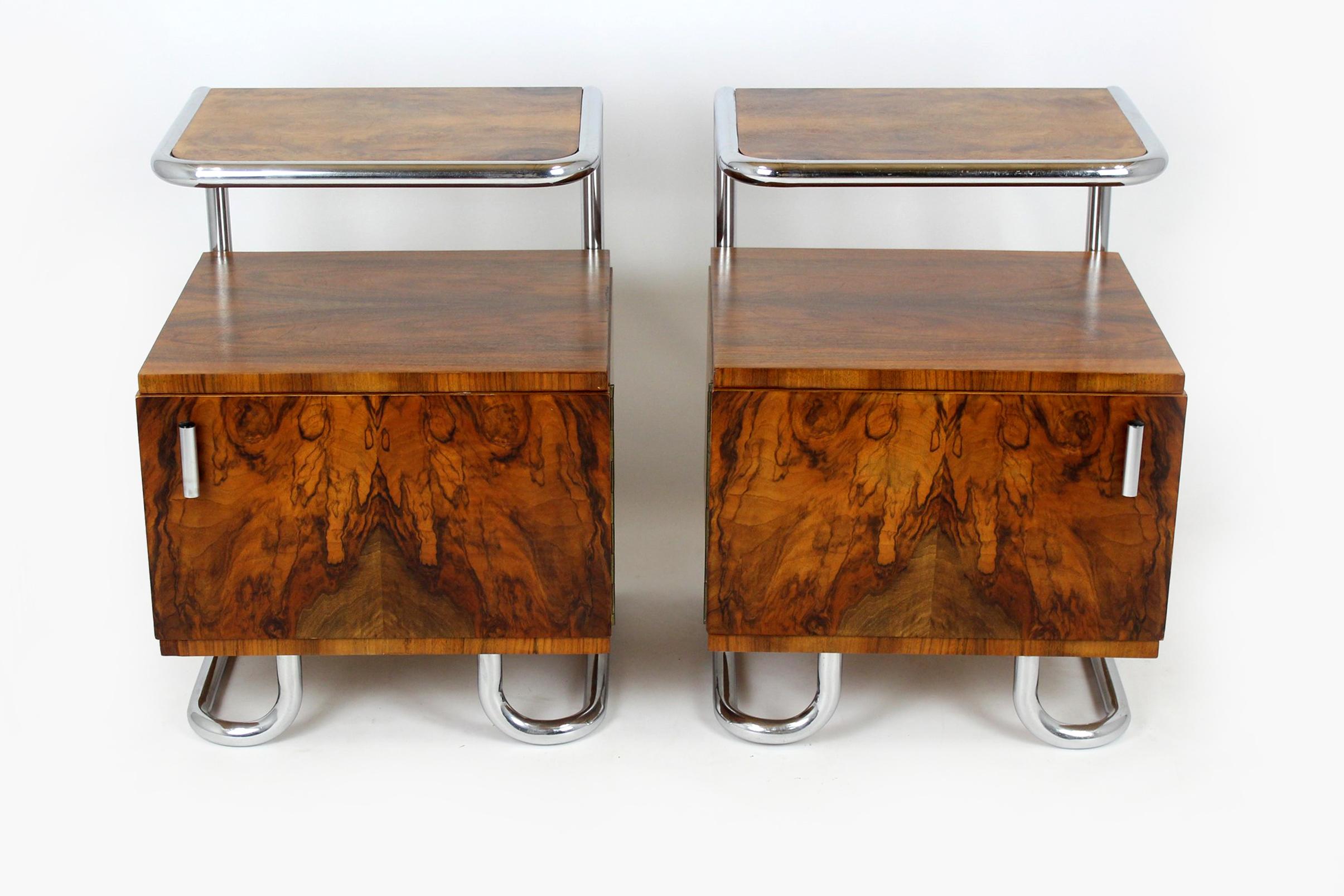 
This set of two Bauhaus style bedside tables was designed by Hynek Gottwald and produced in the 1930s/40s in Czech Republic. They are made of walnut and a chrome tubular steel frame.
The bedside tables have been restored, varnished in a satin