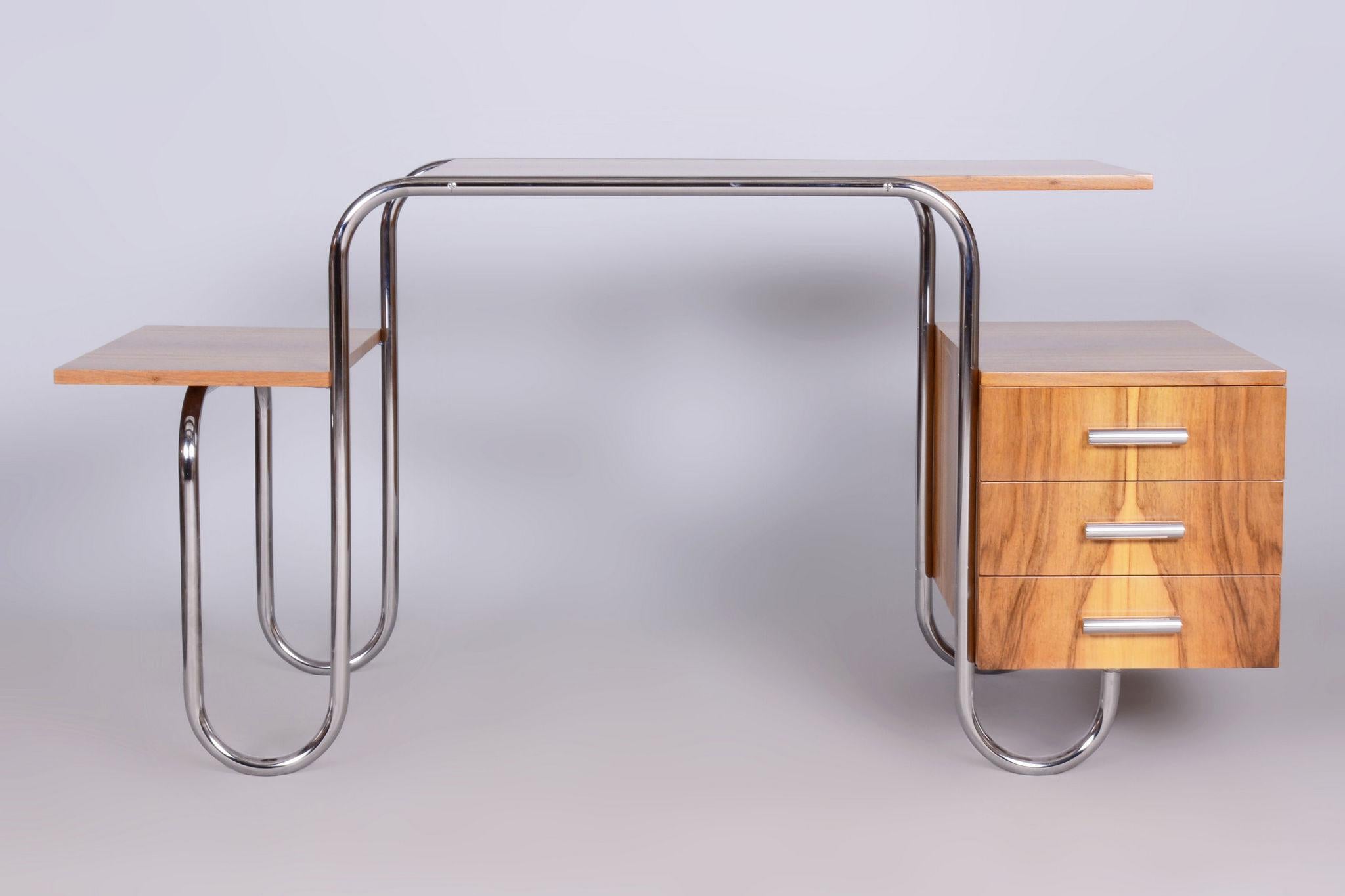 Restored Bauhaus Writing Desk

Catalog model: PS 8
Material: Walnut, Chrome-plated Steel
Source: Czechia (Czechoslovakia)
Period: 1930-1939

This desk was designed by French modernist architect André Lurcat.

The chrome parts have been cleaned and