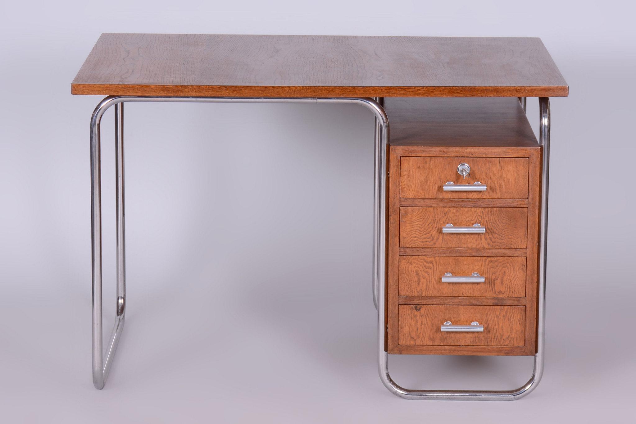 Dimensions of the desk:
Height: 78 cm (30.7 in)
Width: 115 cm (45.3 in)
Depth: 75 cm (29.5 in)

Leg space:
Height: 72.5 cm (28.5 in)
Width: 65 cm (25.6 in)

Made by Kovona, a renowned Czech manufacturer and dealer from the 20th century.

It has been