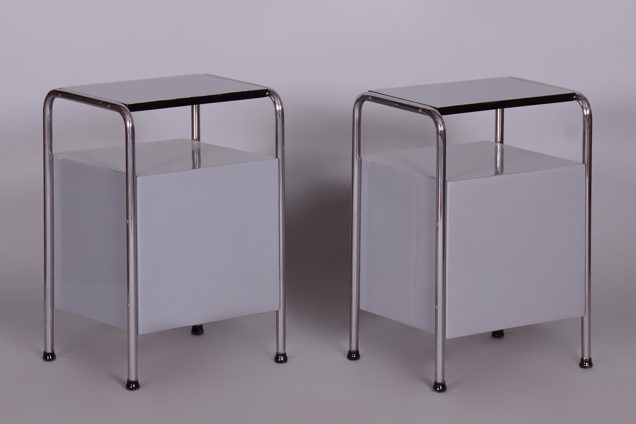 Restored pair of bed-side tables by Vichr a spol.

Maker: Vichr a spol.
Source: Czechia (Czechoslovakia)
Period: 1930-1939
Material: Chrome-Plated Steel, Lacquered Beech Wood to High Gloss

It has been fully restored by our professional