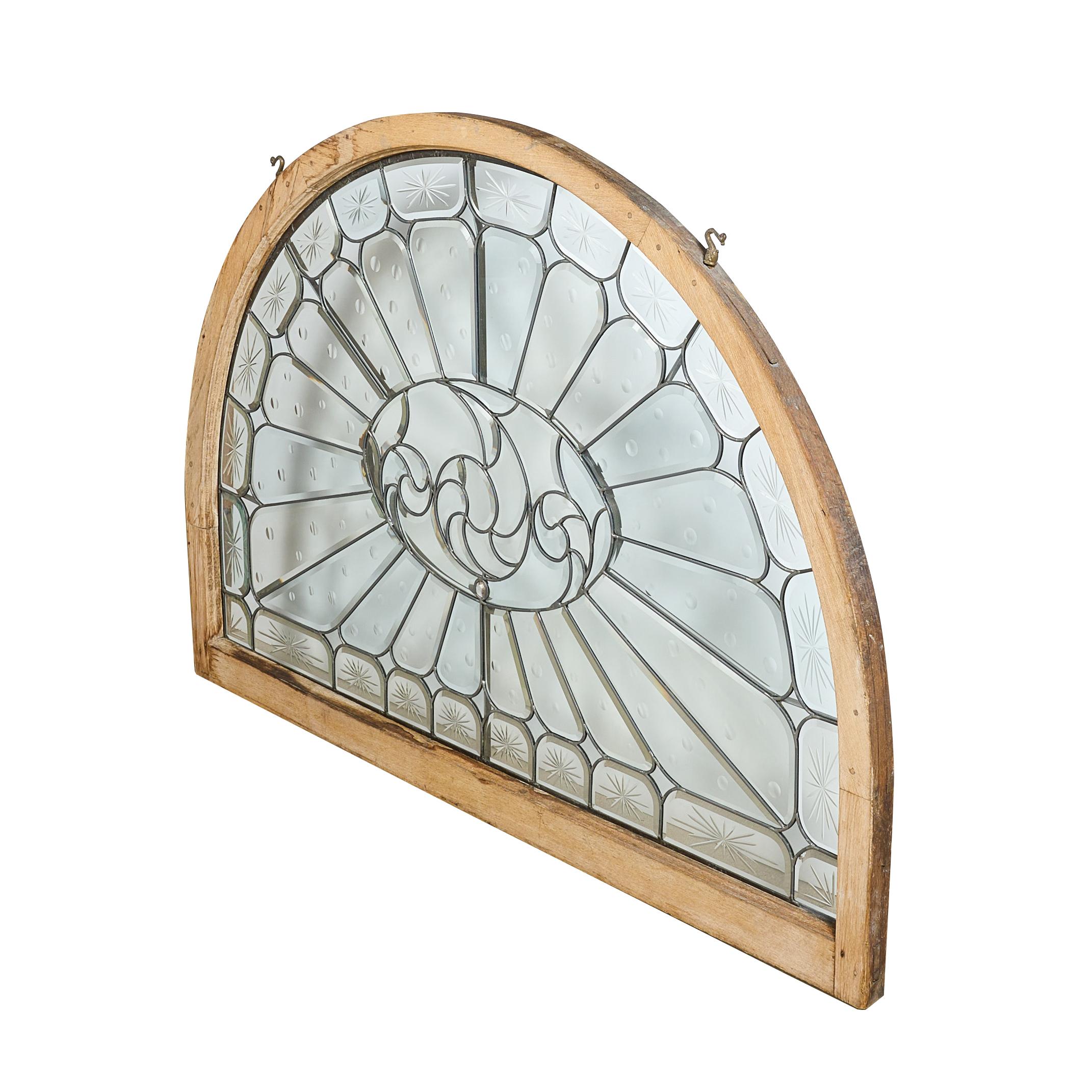 The best beveled and wheel cut arched window. Antique window restored by the world famous Mark Bogenrief.
