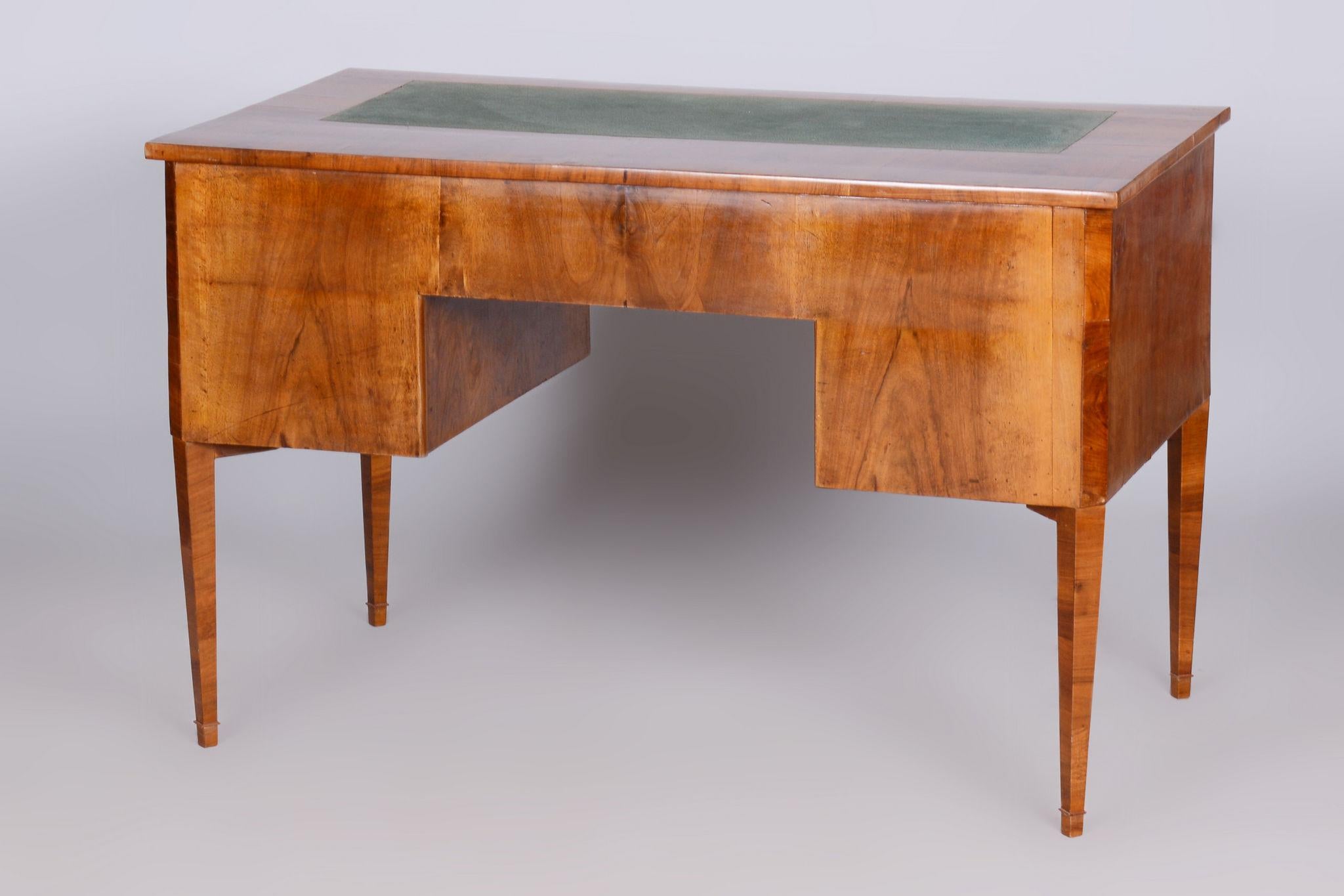 Restored Biedermeier Walnut Writing Desk.

Source: Czechia (Czechoslovakia)
Period: 1830-1839
Material: Walnut

Leg space:
Height: 62 cm (24.4 in)
Width: 51 cm (20.1 in)

Revived polish. The top plate is fitted with a green writing insert.

Our