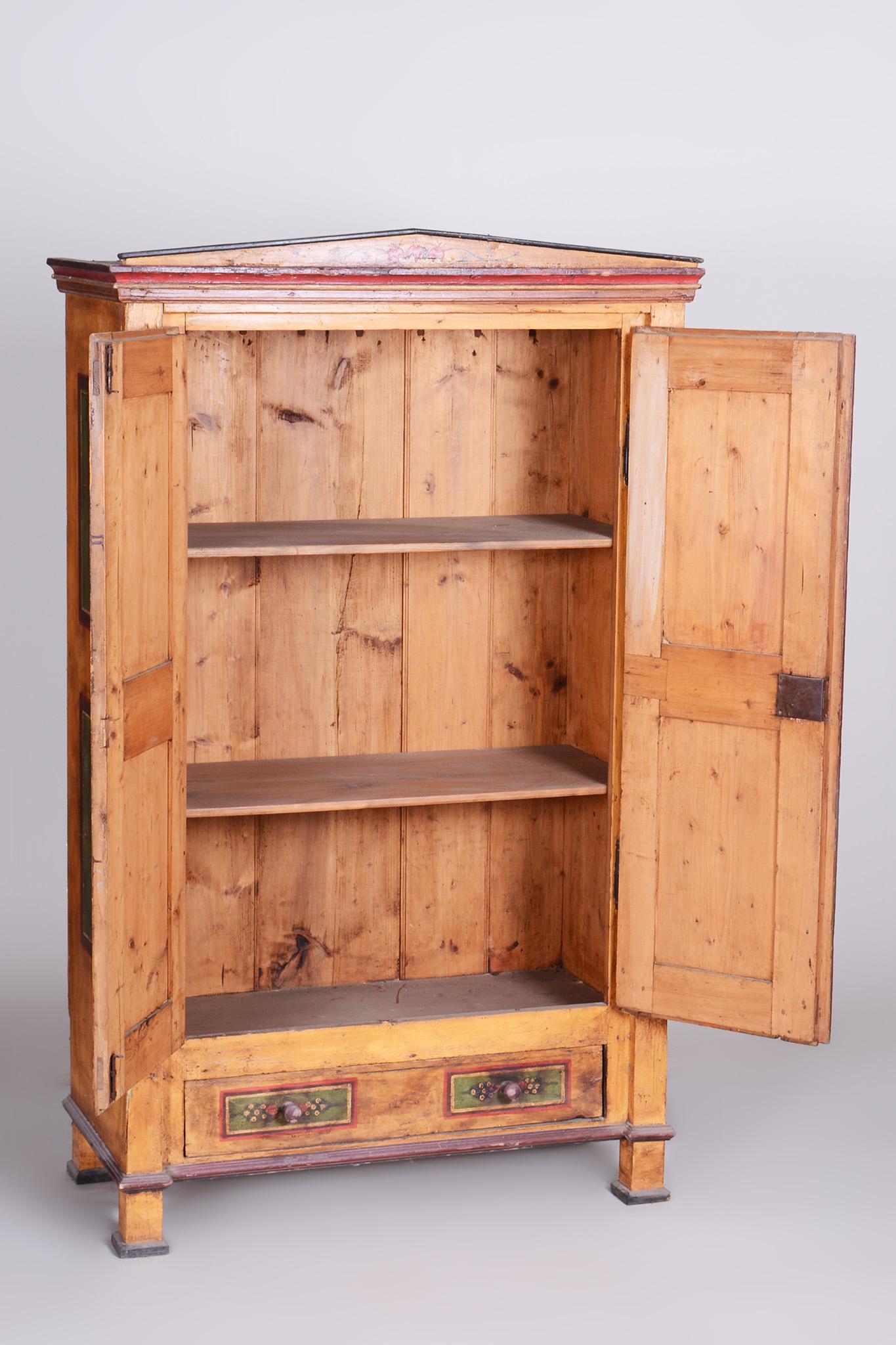 Restored Biedermeier Spruce Wardrobe With Original Paintings.

Source: Czechia
Period: 1800-1809
Material: Spruce

Professionally restored. 

This item features classic Biedermeier elements. This style is characterized by visual simplicity,