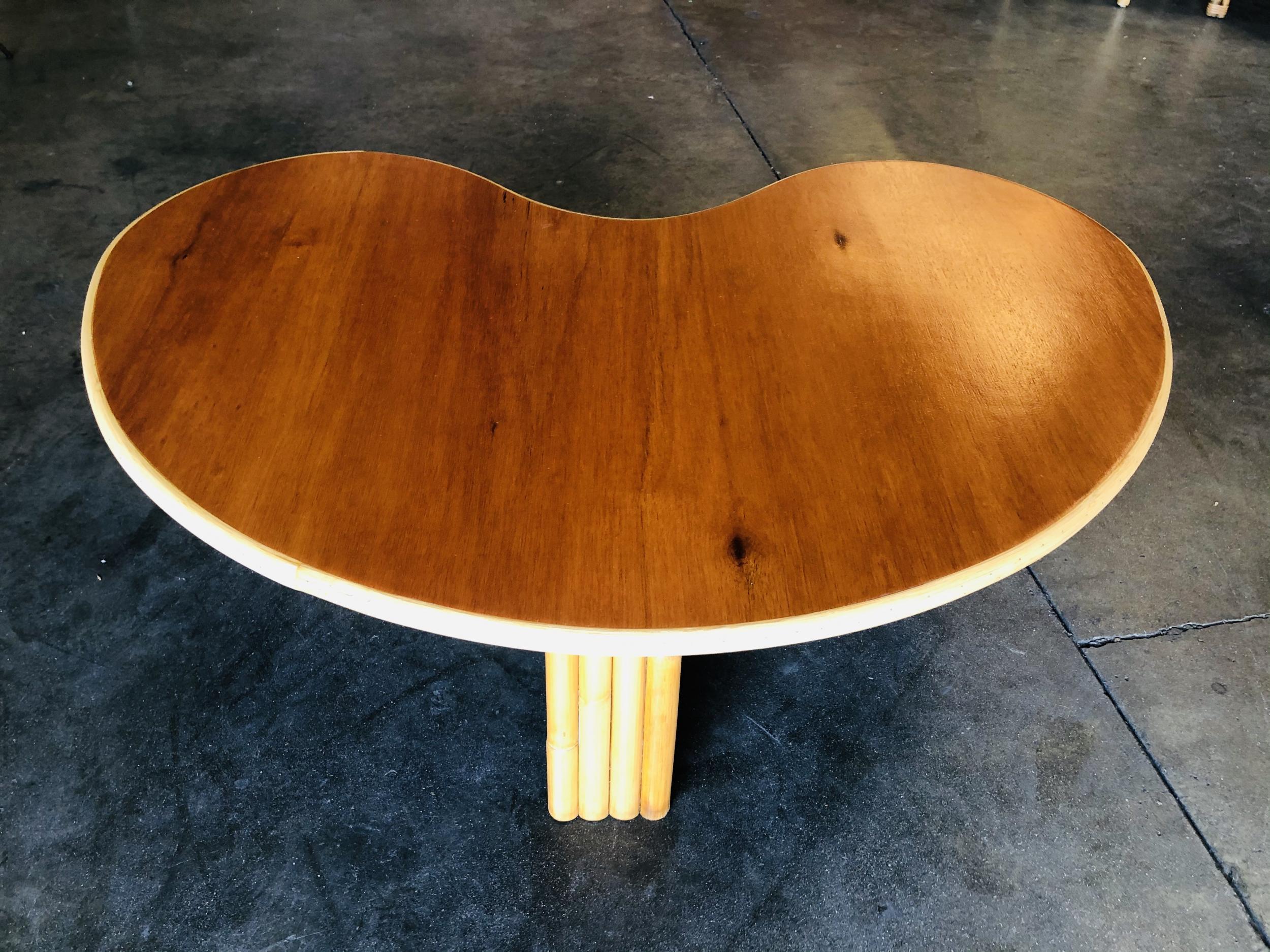 Restored Biomorphic Rattan and Mahogany Coffee Table with Vertically Stacked Leg In Excellent Condition In Van Nuys, CA