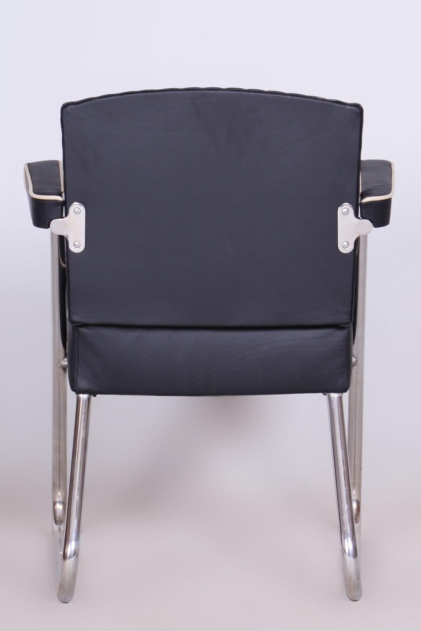 Restored Black Bauhaus Armchair.

Maker: Mauser
Designer: Gilbert Rohde
Material: HIgh-Quality Leather, Chrome-Plated Steel
Source: Germany
Period: 1930-1939
Newly reupholstered in high quality.
The chrome parts have been cleaned and professionally