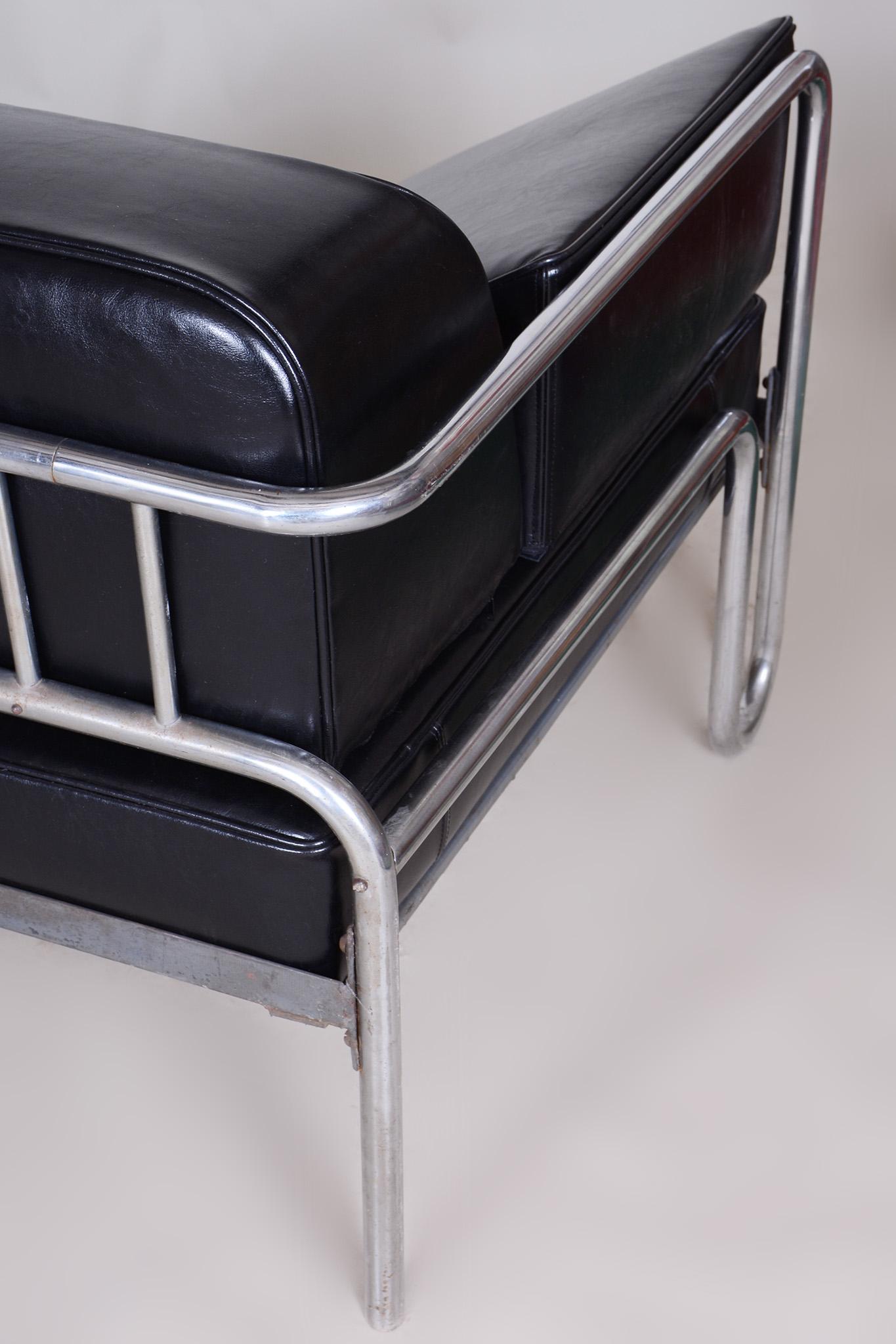 Restored black Bauhaus sofa.

Source: Czechia (Czechoslovakia)
Period: 1930-1939
Number of Seats: 3
Material: Chrome-plated steel, High-quality leather

It has been fully restored by our professional refurbishing team in Czechia according to