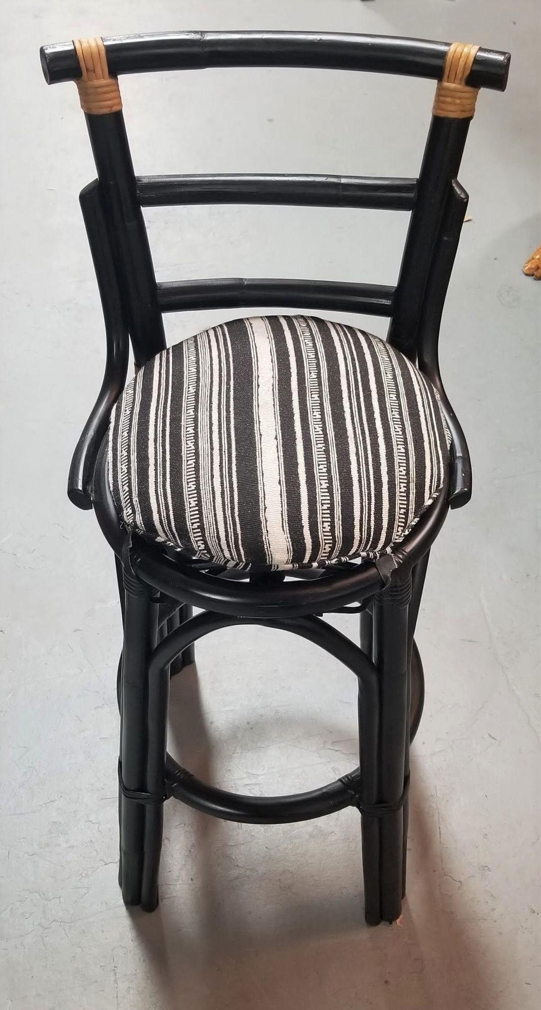 Pair of 2 rattan bar stools painted black with natural wrappings and original stripped seats. Perfect for your home bar or counter. In the style of John Wisner Design.

Seat Height 29
