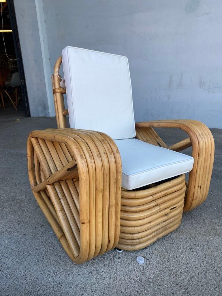Rare child-size six-strand square pretzel rattan lounge chair featuring reversed square pretzel arms and an over-stacked height rattan base with white vinyl seats. In this set is a set of 2 chairs. 

We only purchase and sell only the best and