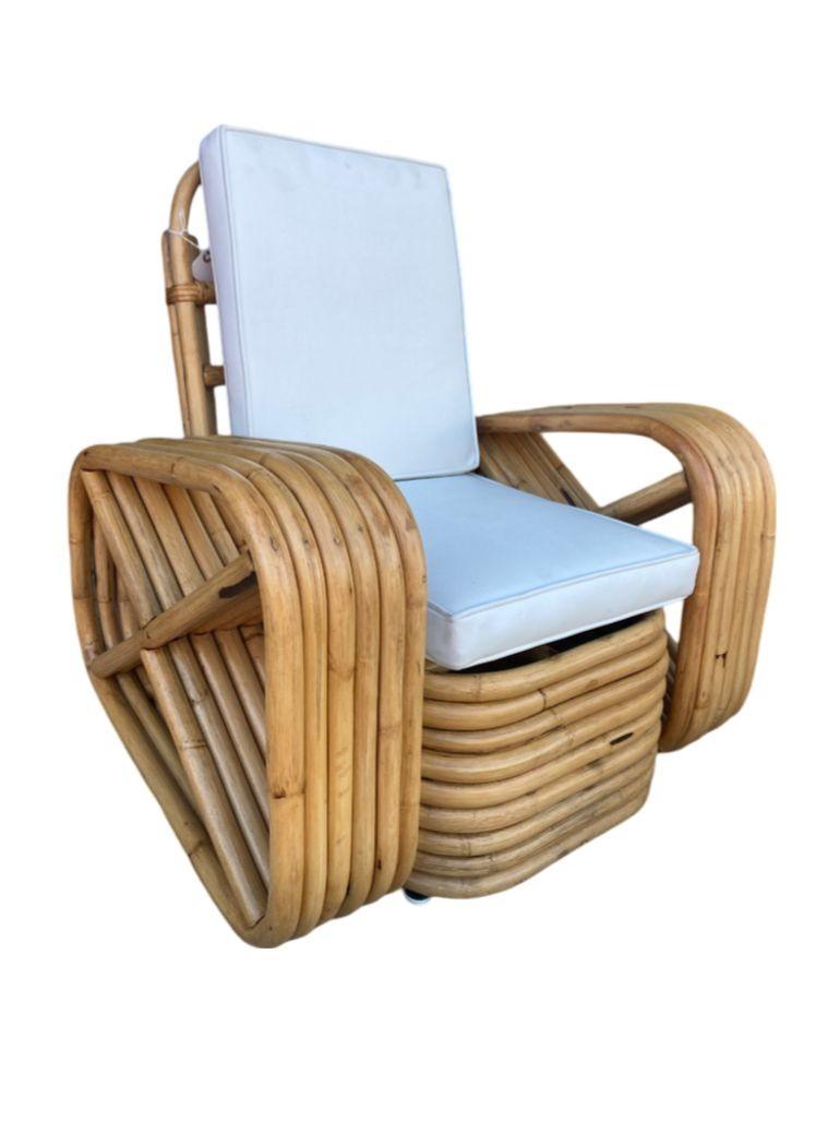 This beautifully restored Paul Frankl-inspired pair of child-size six-strand square pretzel rattan lounge chairs, each featuring reversed square pretzel arms and an over-stacked height rattan base with a white vinyl seat. This Frankl style set was