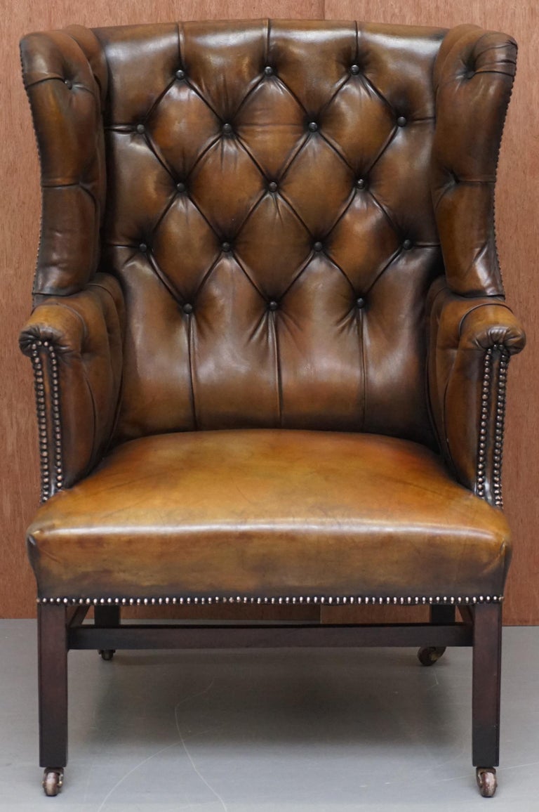 We are delighted to offer for sale this stunning fully restored cigar brown hand dyed leather Victorian Chesterfield Porters wingback armchair

A very good looking and nicely refurbished piece. This is an original Victorian circa 1860 armchair,