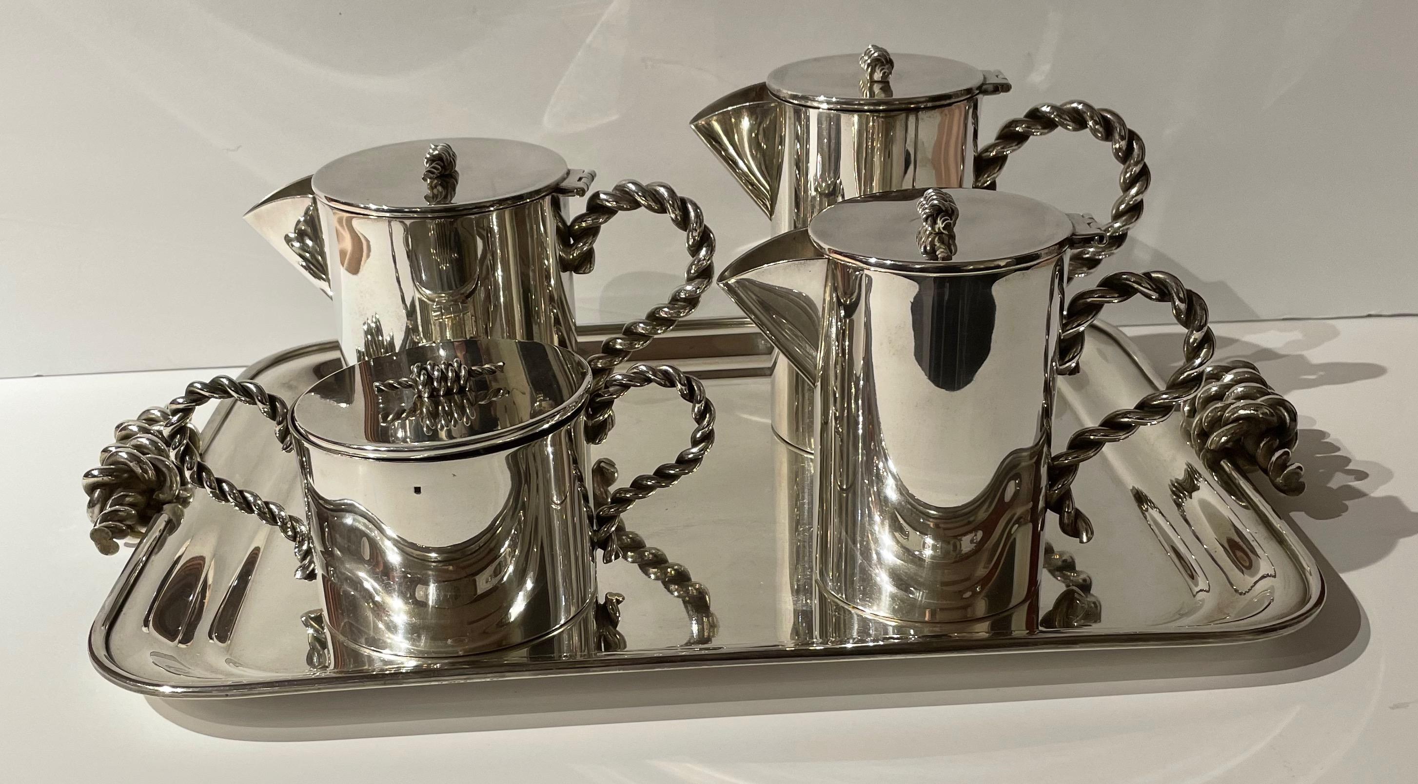 Coffee tea set and tray Art Deco newly restored fresh silver plate. An unusual design with a rope chain created for all handles gives this set a special point of view. Each piece represents an aspect of this design. Strong construction which is