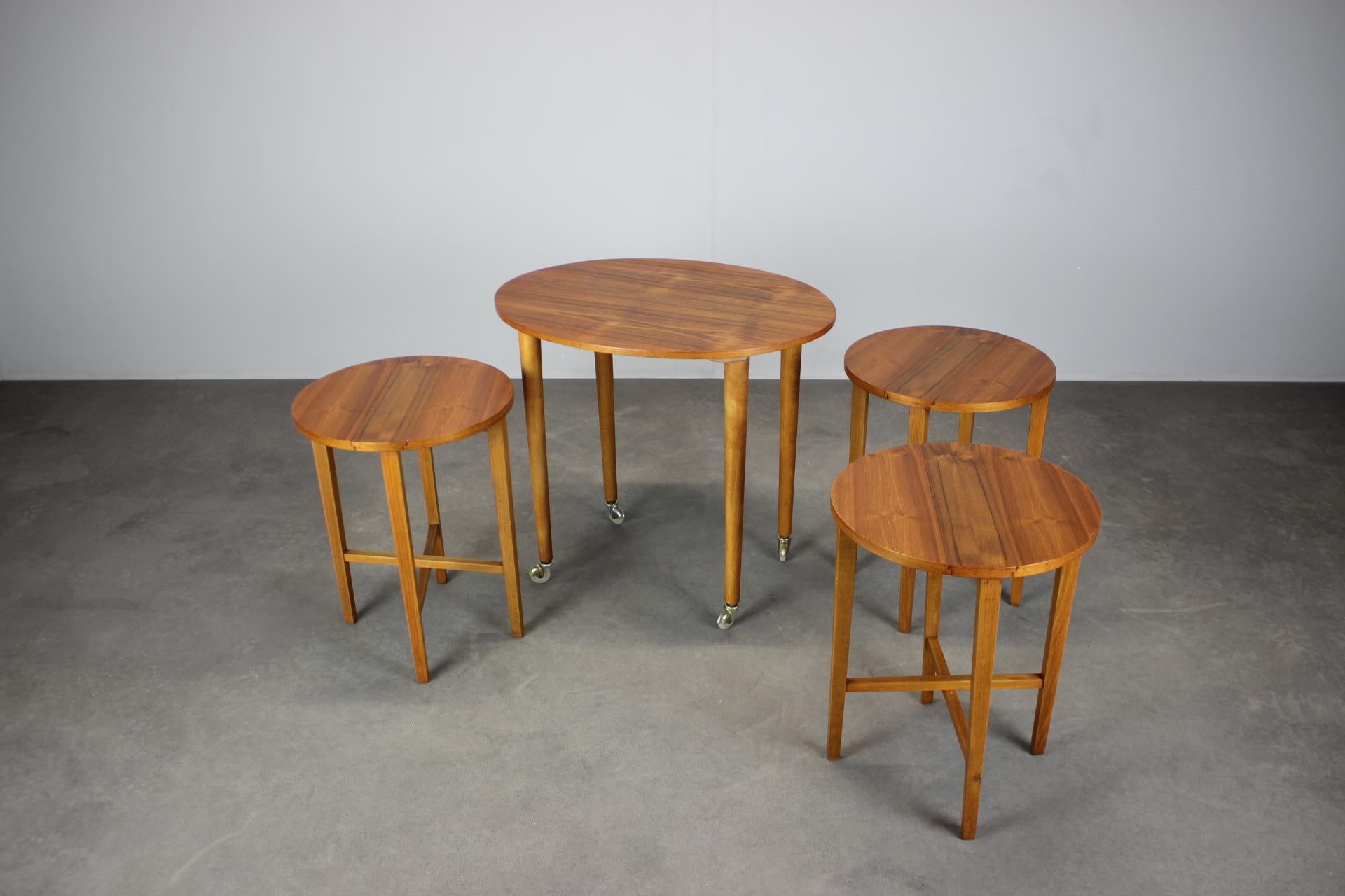 This Mid-Century Modern folding table with three nesting chairs was designed by Poul Hundevad in Denmark in the 1960s.
A brilliant multifunctional piece, the three chairs fold flat and store neatly under the tabletop, turning the set into a compact