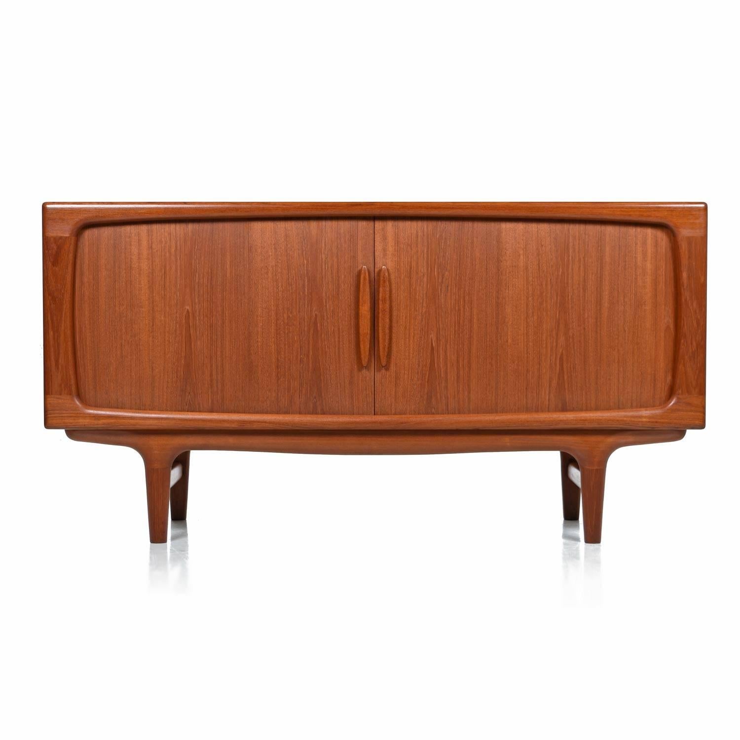 Restored vintage Danish teak credenza made by Dyrlund in Denmark, 1970s. Masterfully crafted with seamlessly pleated tambour doors along the facade. Slide the doors to reveal adjustable shelf cabinet space and four pull out drawers. Sideboards like