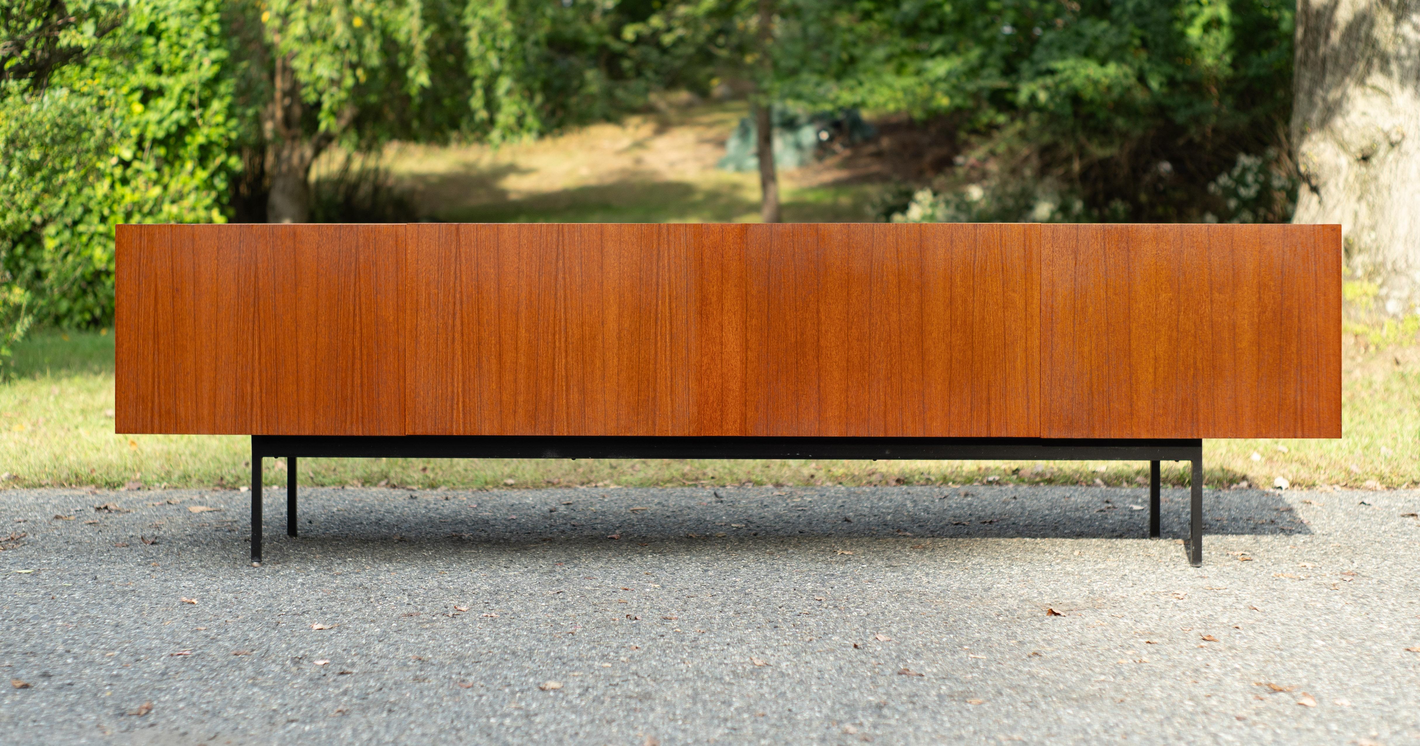 Made in Germany in the 1950s by Behr Mobel, this cabinet was designed by Dieter Waeckerlin, who designed many different variations for Behr. This is one of the best ones, in our opinion. From every angle, this cabinet exudes style, confidence, and
