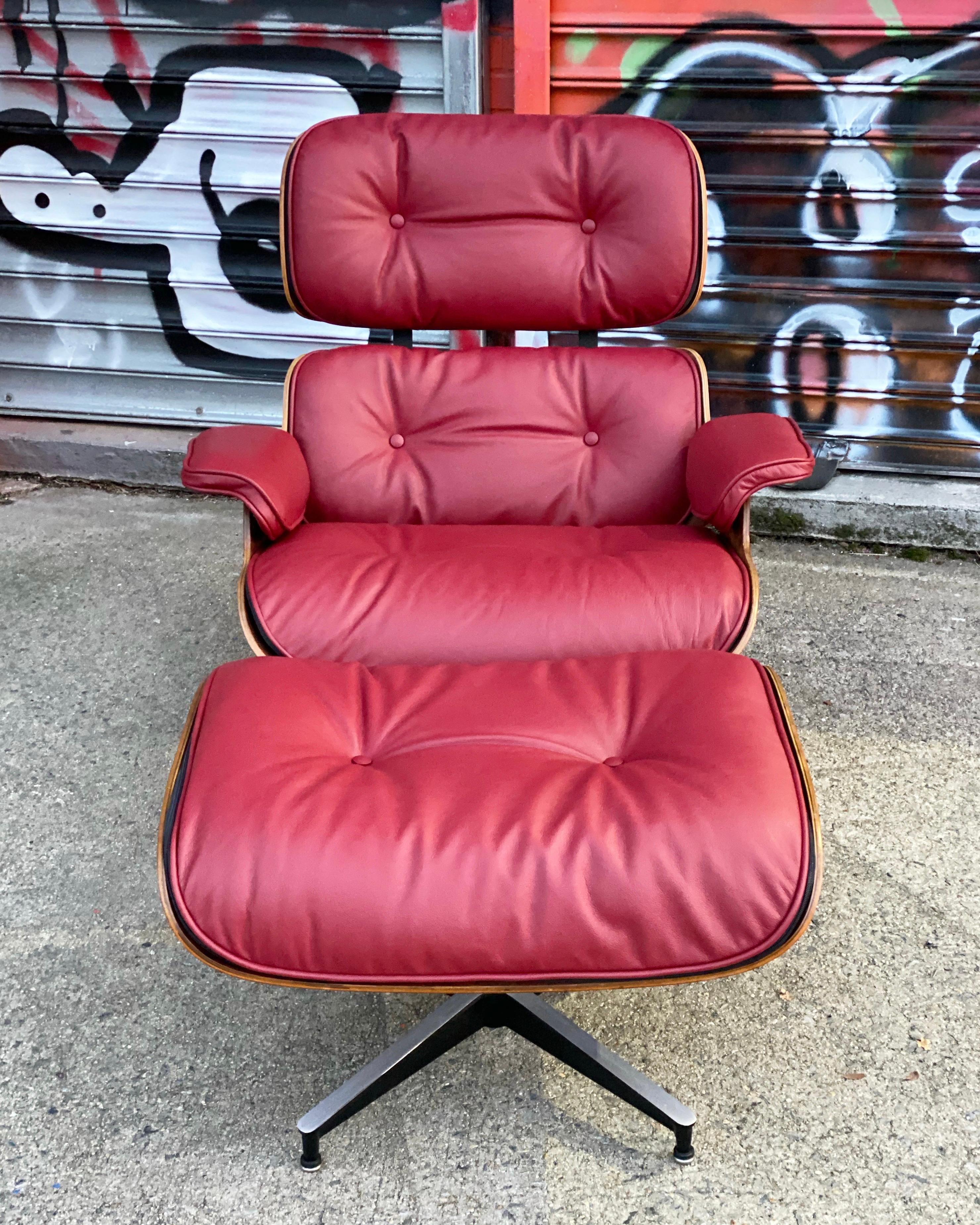 Gorgeous classic Eames lounge chair with an updated custom look. Restored vintage set in rose wood, of original Herman Miller production. Wood has been refinished and leather cushions redone in Chianti leather. Rubber shock mounts replaced in the