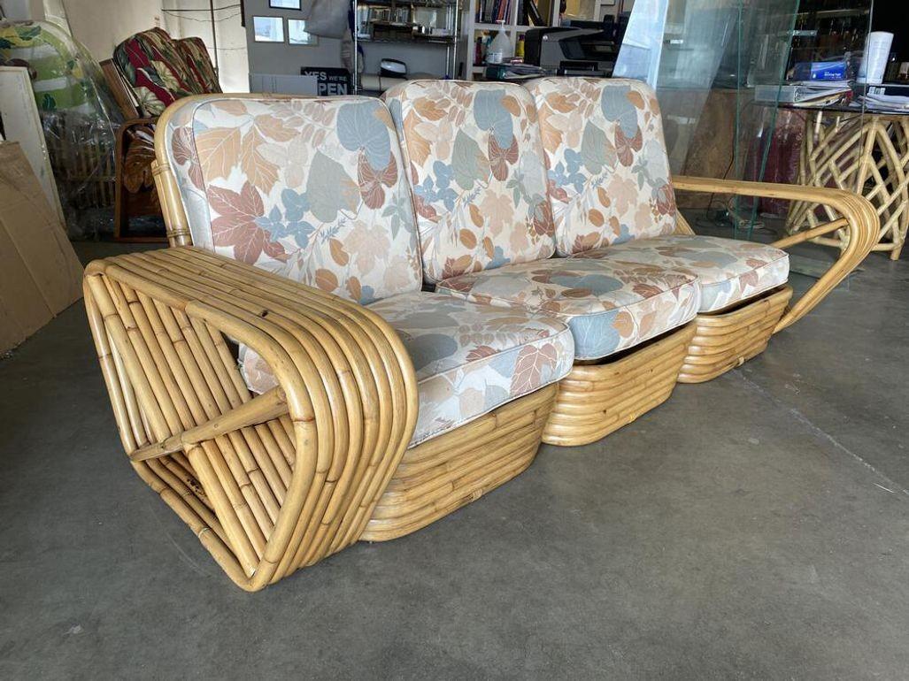 Restored Art Deco 8-strand rattan square pretzel arm sectional sofa with seating for three people. The sofa features Paul frankl inspired square pretzel armrest in a rare 8-stand configuration with a stacked rattan base. 

1930, USA

We only