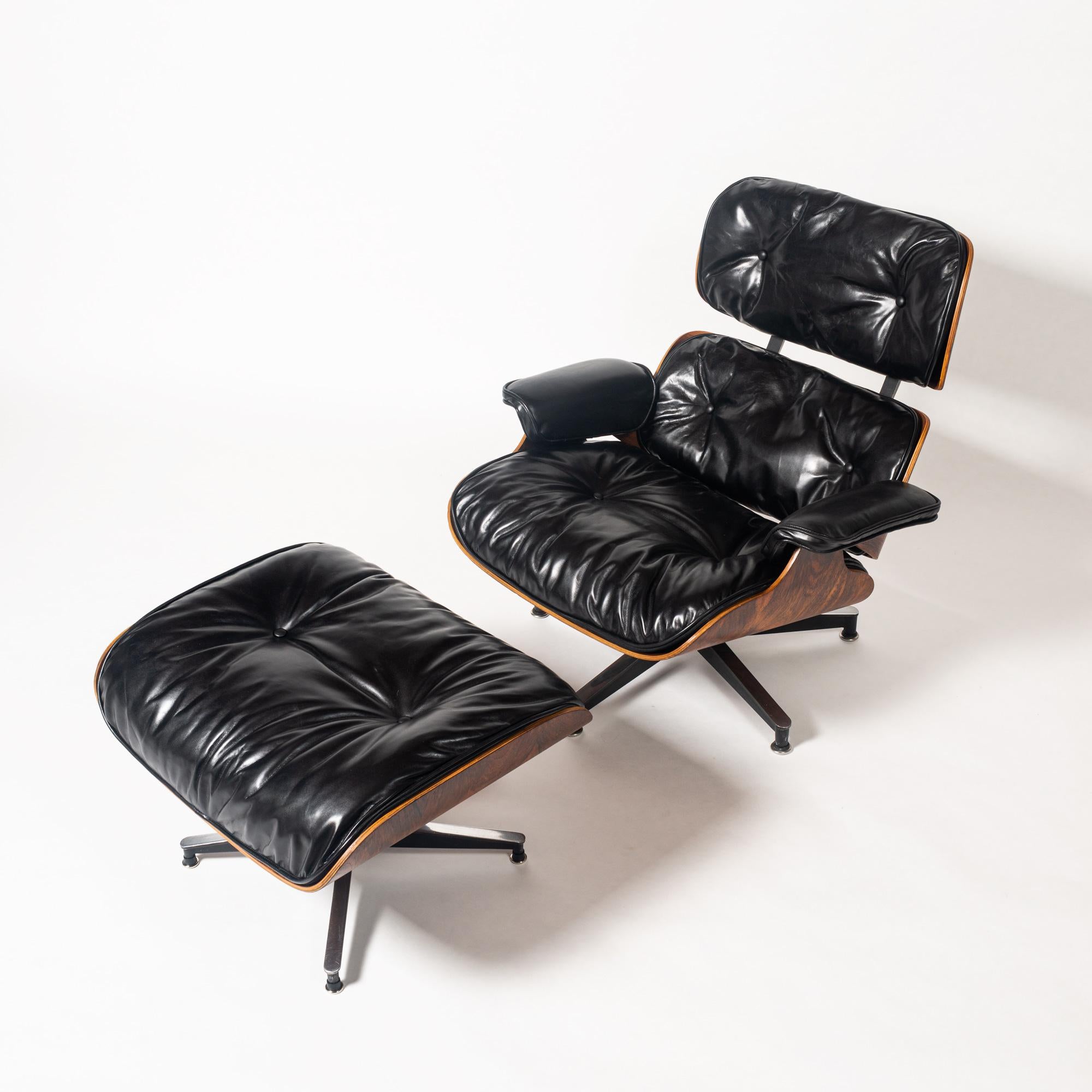 This extremely rare collectible is one of the earliest known productions of the 1956 Eames lounge chair with ottoman, non-stamped frame. In classic black and rosewood lacquered shell, this piece has been professionally restored by Modern Conscience