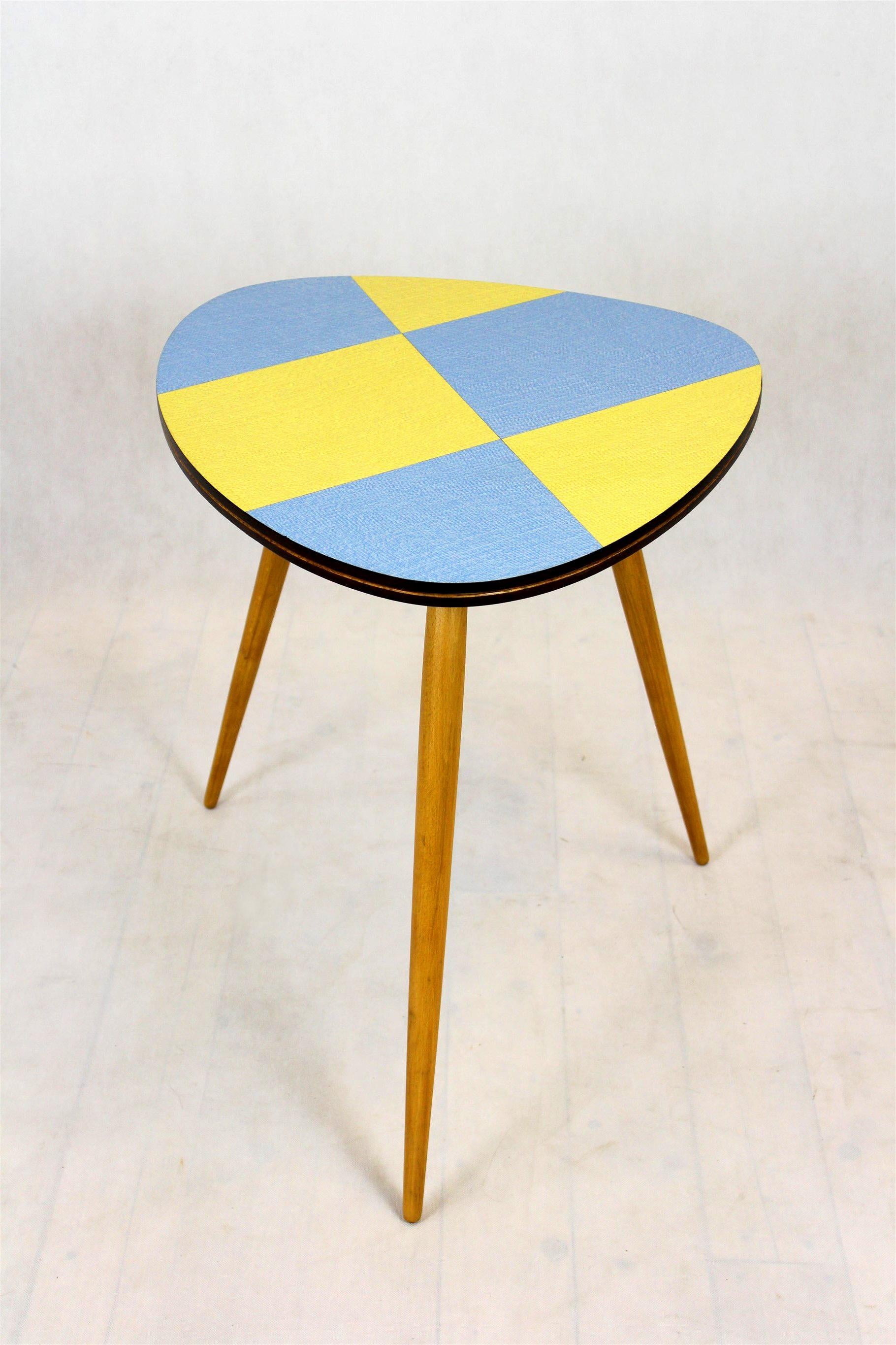 This coffee table was produced in the 1960s by Drevopodnik Brno in former Czechoslovakia. It features original, multicolored laminate top with a geometrical pattern.
It has been restored, lacquered in satin.
The table top is in its original, very