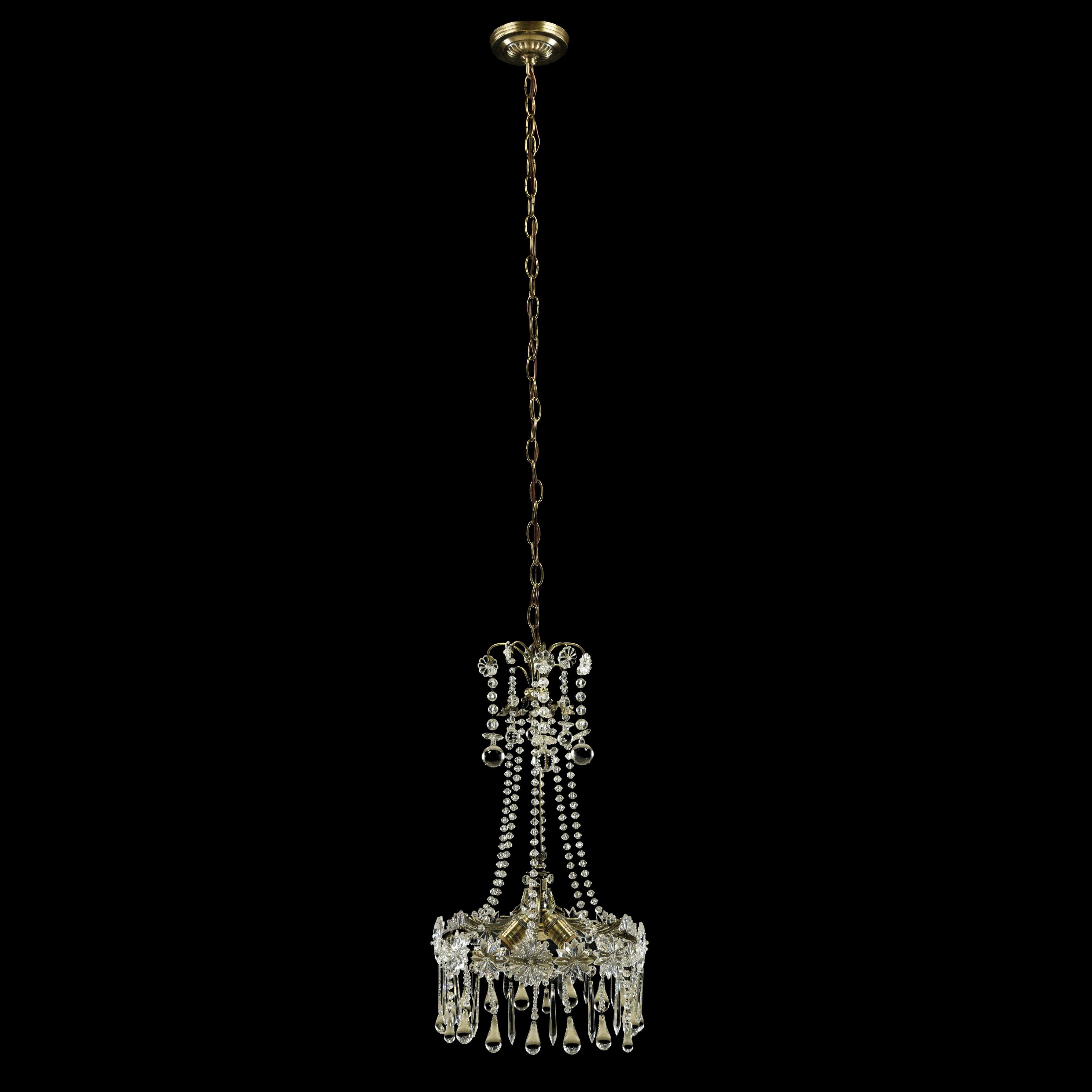 Restored clear floral crystal chandelier with ornate brass hardware. Takes three standard medium base light bulbs. Cleaned and restored. One available. Please note, this item is located in one of our NYC locations.