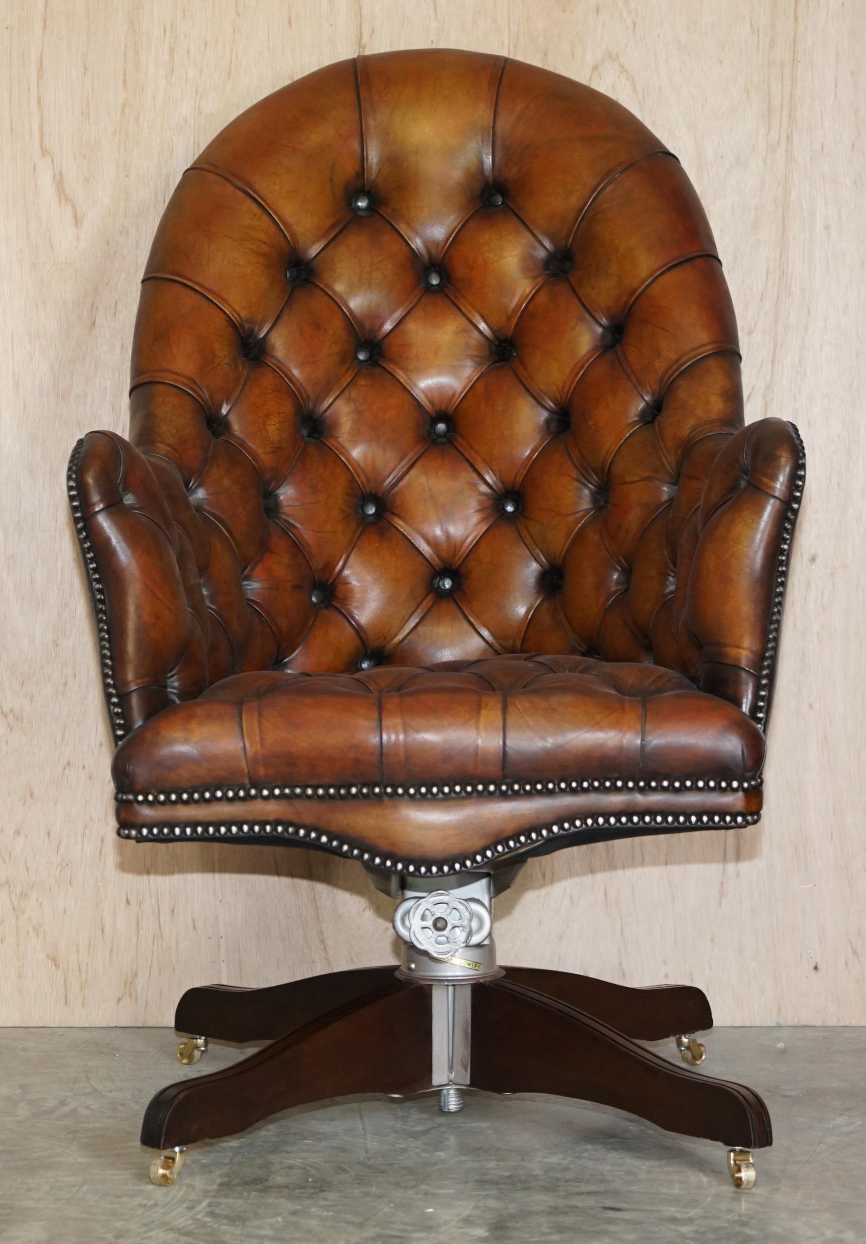 We are delighted to offer this stunning fully restored aged brown leather Godfather Directors armchair with original Hillcrest base circa 1920’s

This is a very fine and well made English circa 1920’s Directors chair, it has a coil sprung base,