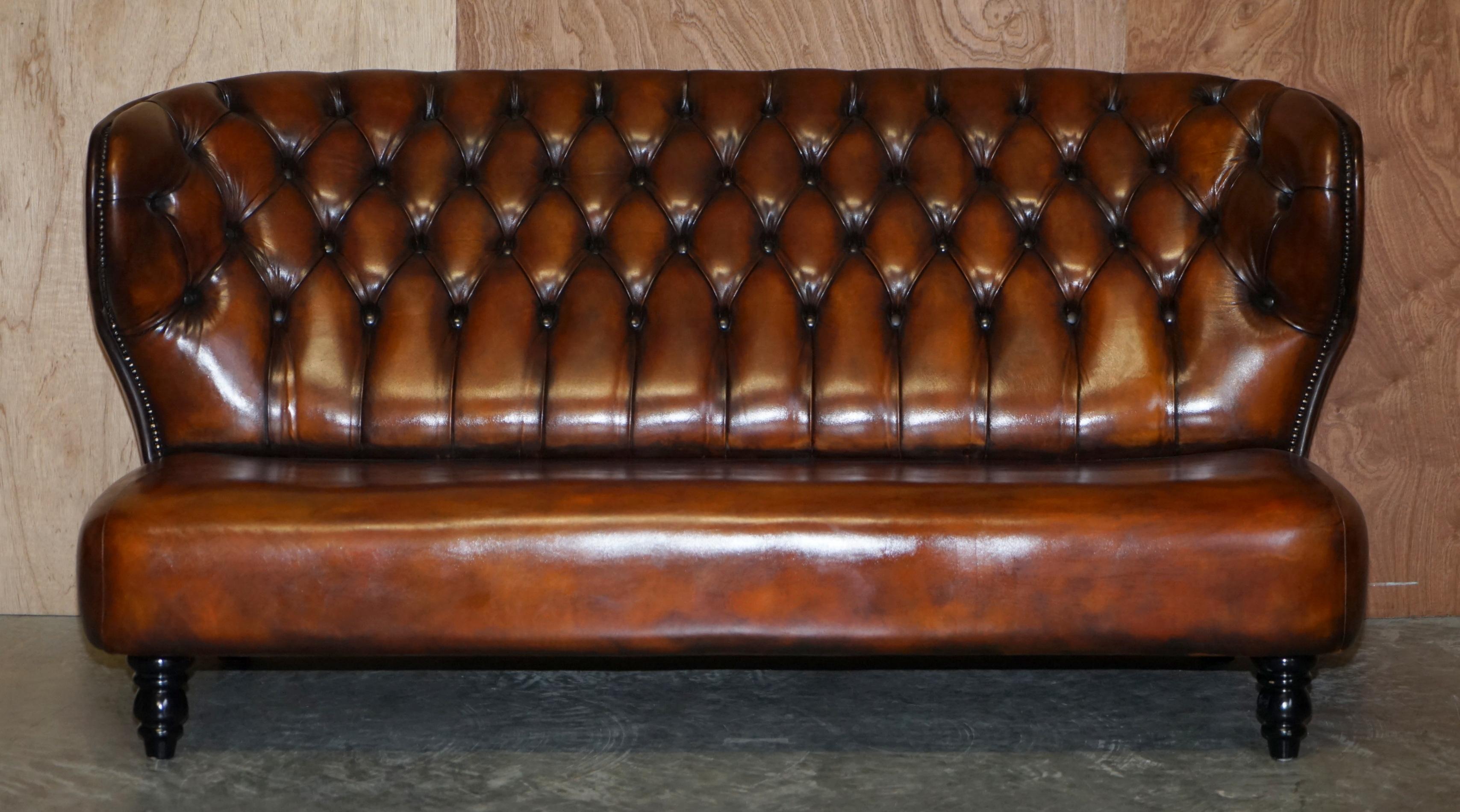 We are delighted to offer for sale this stunning fully restored whiskey brown leather contemporary designer sofa.

Where to begin! This sofa is absolute eye candy from every angle, it has the original leather hide, the leather is in fully restored