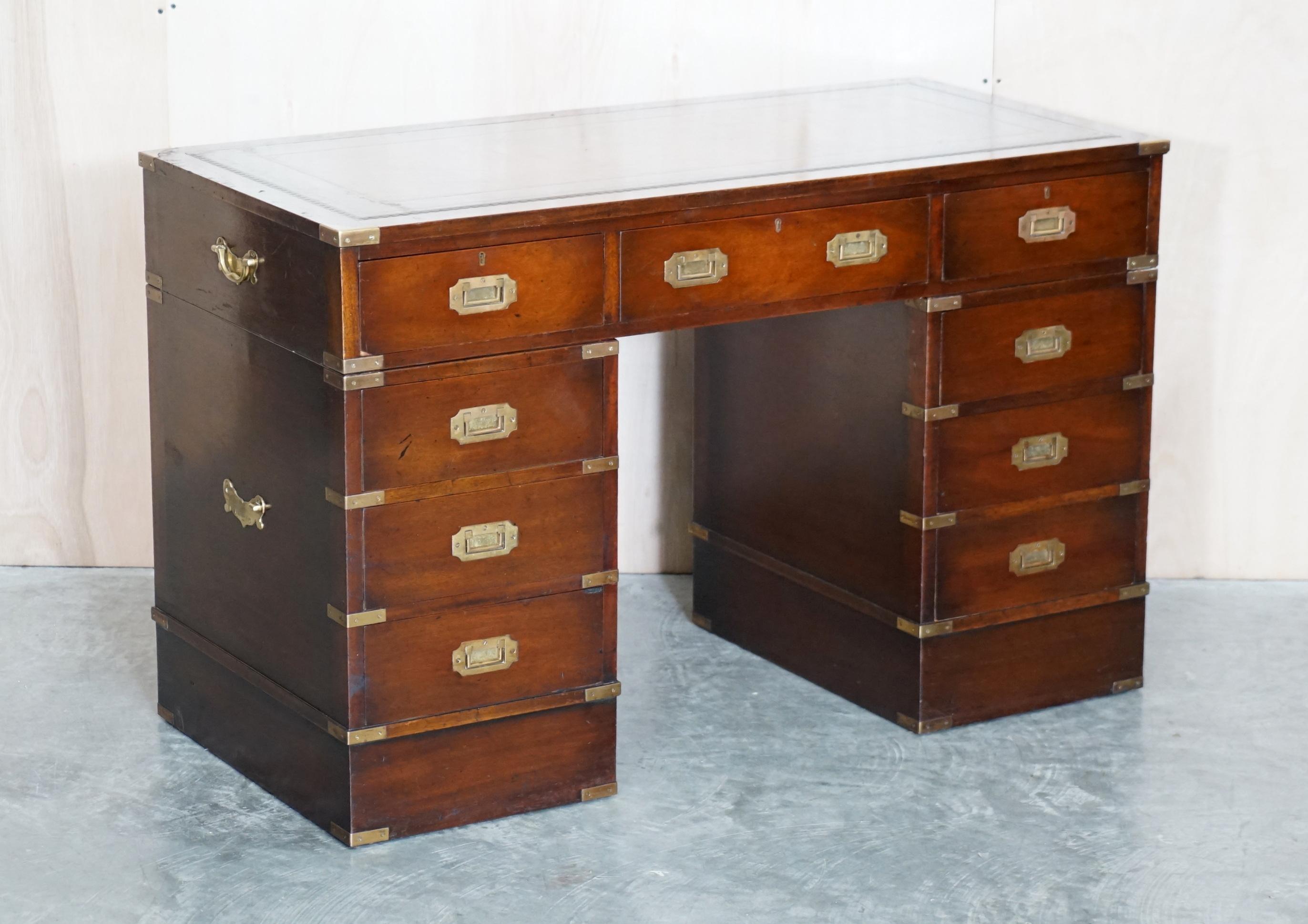 We are delighted to offer for sale this lovely vintage Military Campaign twin pedestal partners desk with hand dyed, cigar brown leather writing surface

This is a wonderful find, quite rare in the sense that its all drawers, 9 in total, usually