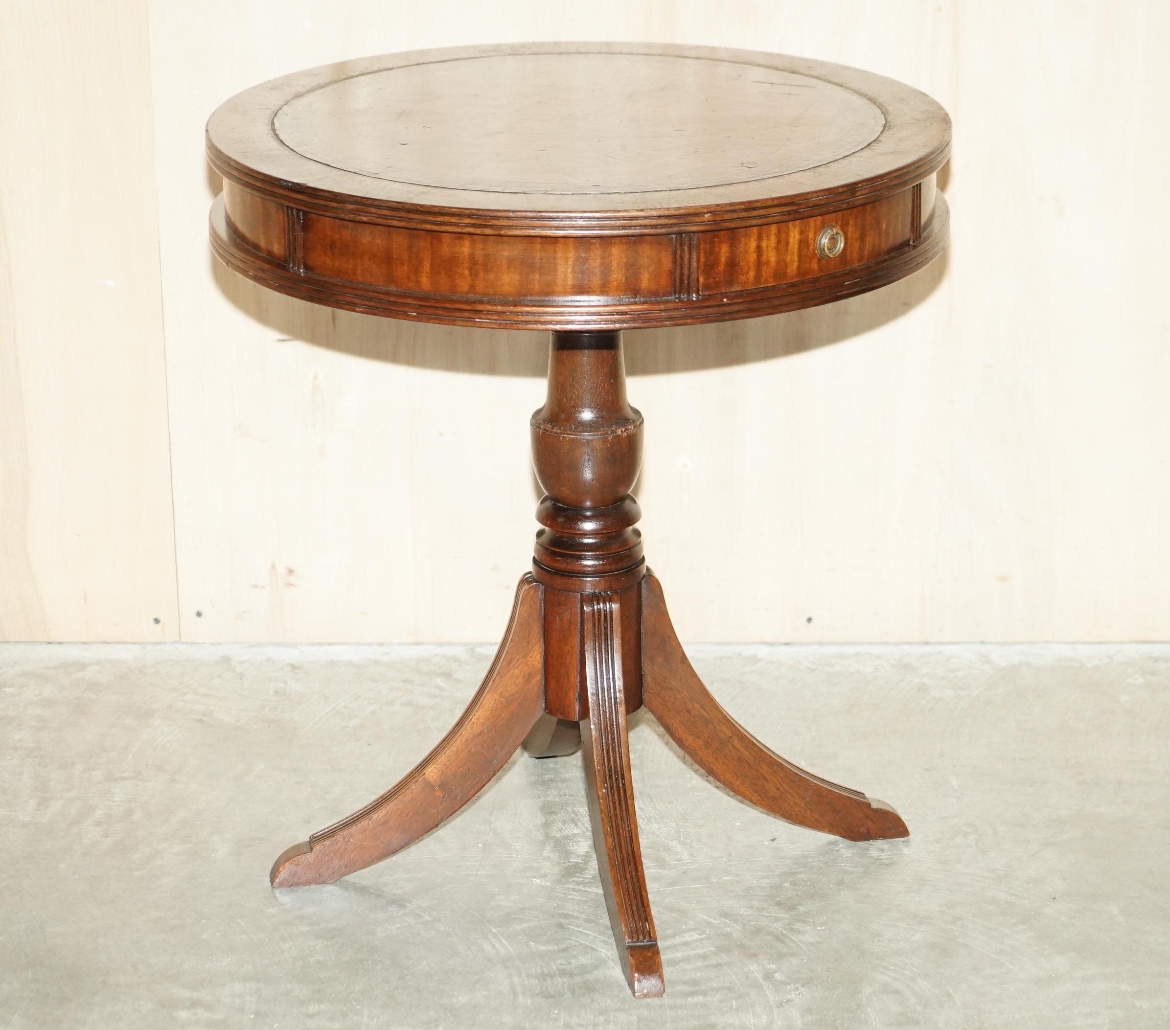 We are delighted to offer for sale this Regency style drum table with mahogany frame and hand dyed Cigar brown leather top 

A very good looking well made and decorative piece, ideally suited as a lamp wine or side table. It has been fully