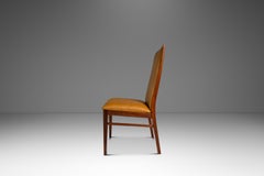 Silla restaurada con respaldo alto de nogal, diseñada por Mil Baughman para Dillingham, EE. UU., hacia la década de 1960