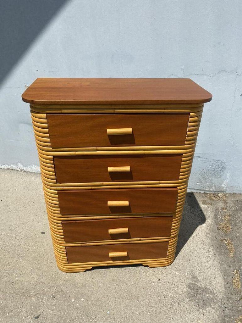 Stacked Art Deco era Stacked rattan Highboy dresser with a mahogany top and five pull-out drawers. Each drawer is a made from solid Mahogany with rattan pulls. 
1930, United States
Dimensions: 50