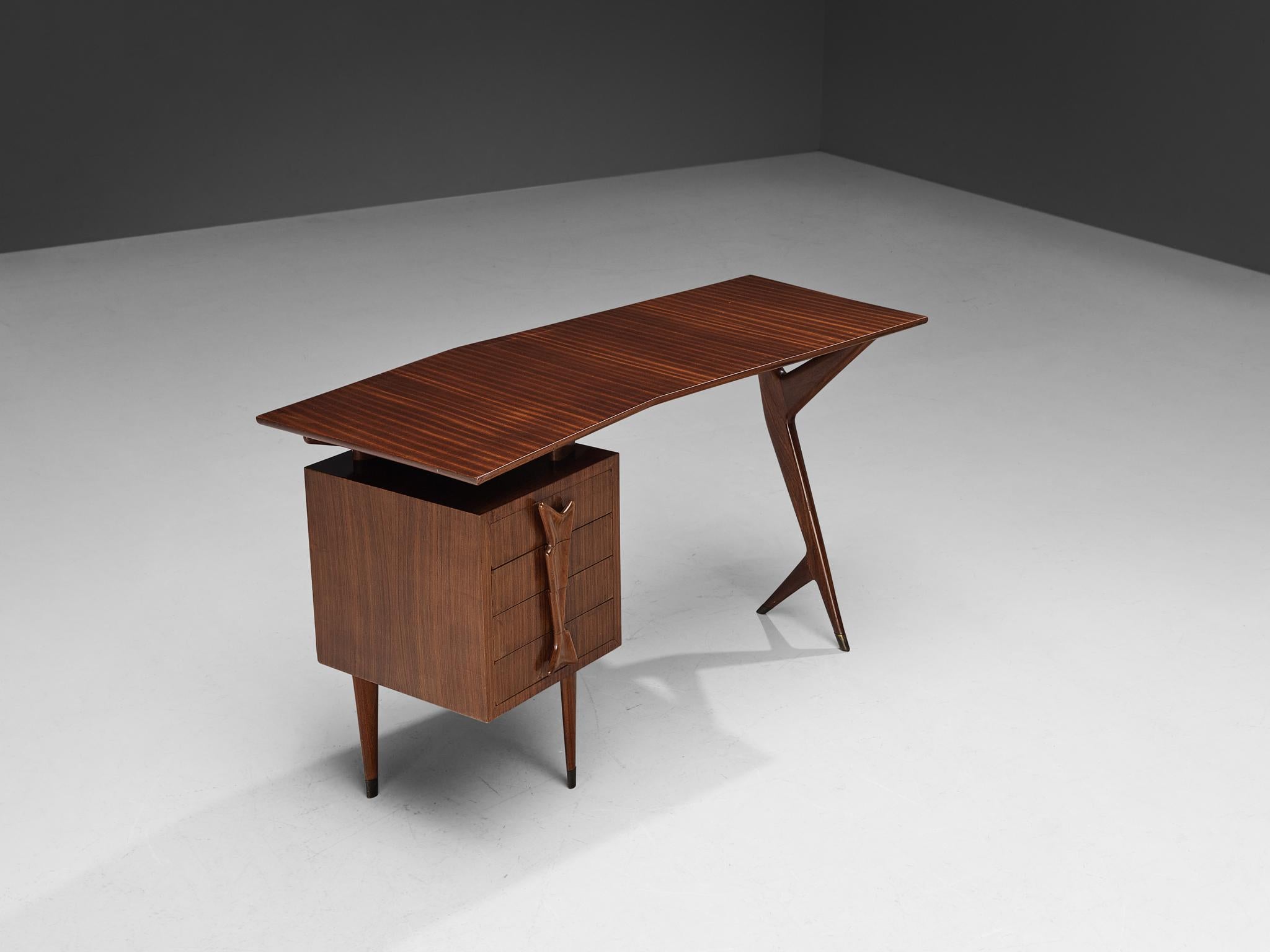 Small writing desk, mahogany, brass, Italy, 1950s.

Sculptural Italian desk with beautiful curved top. This writing table is both refined and elegant in every way. The boomerang shape of the tabletop gives the piece a playful yet elegant character.