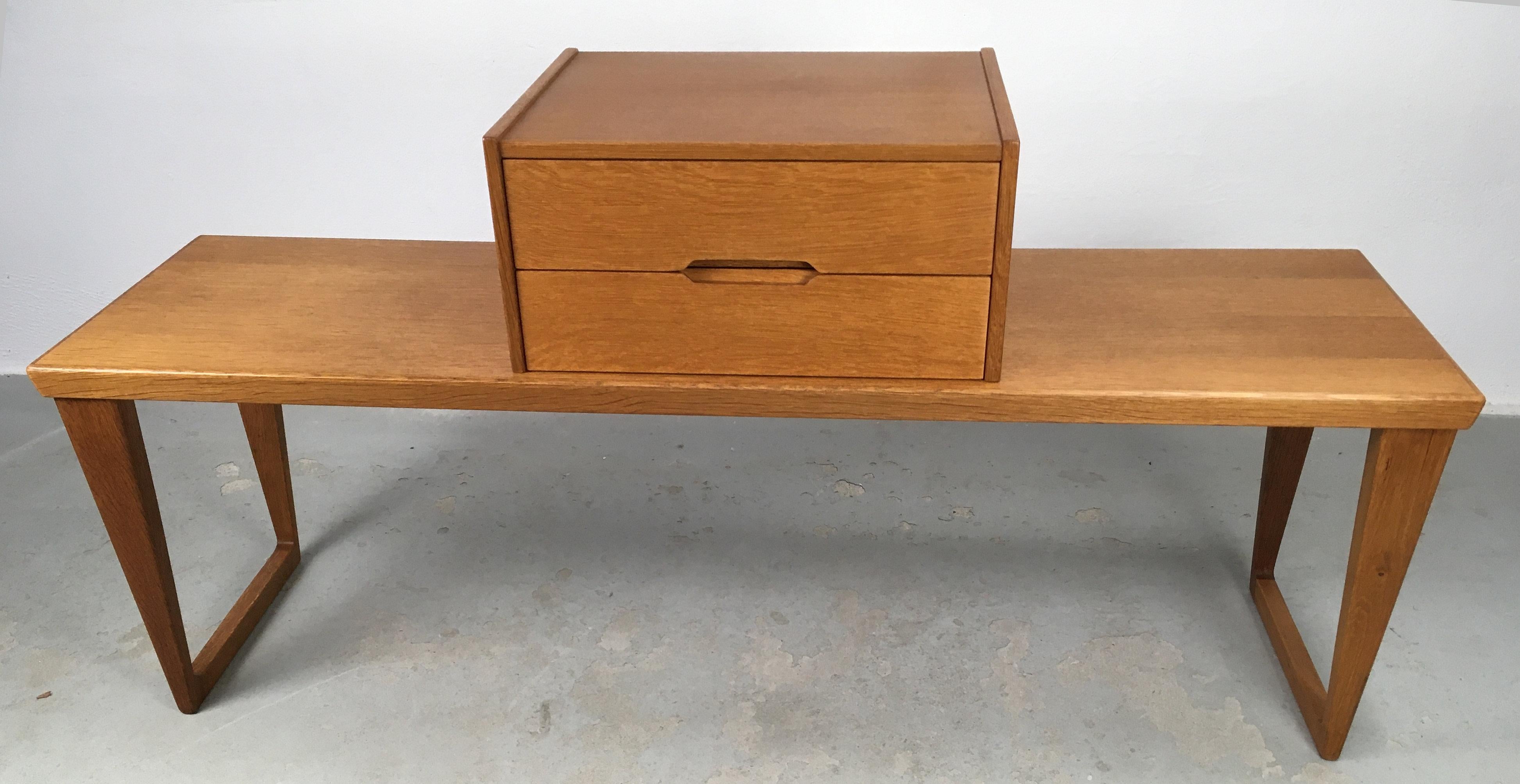 Enterance hall set number 32 in oak consisting of a bench / side table and a small chest of drawers designed by Kai Kristiansen for Aksel Kjaersgaard in the 1960's.

The well designed and crafted set consist of two pieces that can be used together
