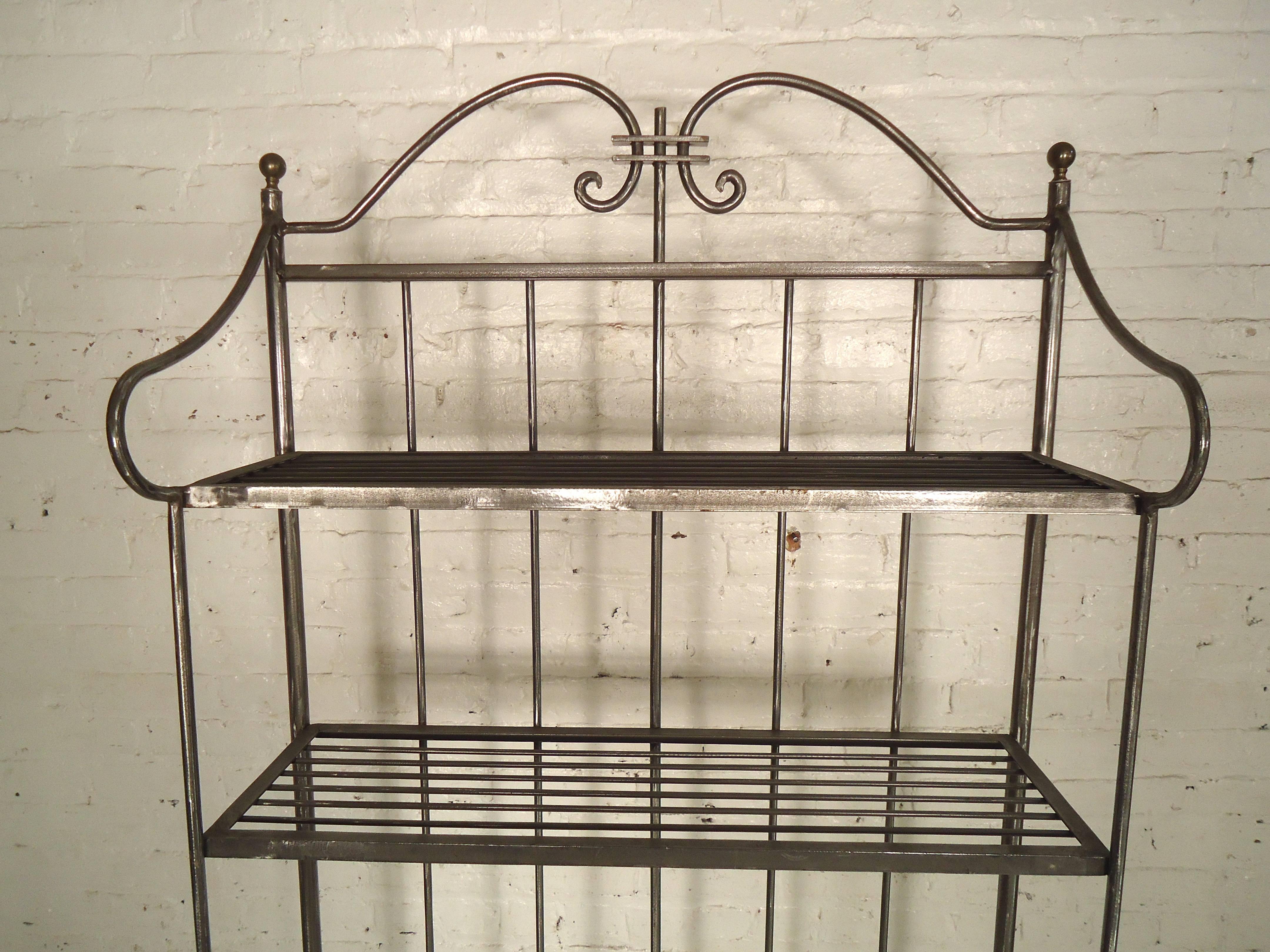 Tall metal kitchen rack, newly stripped and restored in a bare metal style finish. Features four metal shelves and space for a glass or marble shelf.

(Please confirm item location NY or NJ with dealer).
 