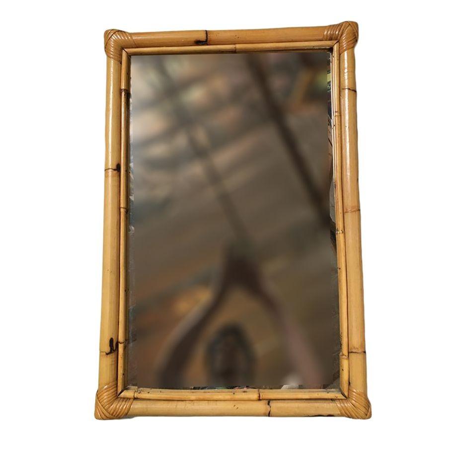 This beautifully restored Frankl style rectangular rattan mirror features a single-strand rattan frame with an inner stick rattan border. Restored to new for you. All rattan, bamboo, and wicker furniture has been painstakingly refurbished to the