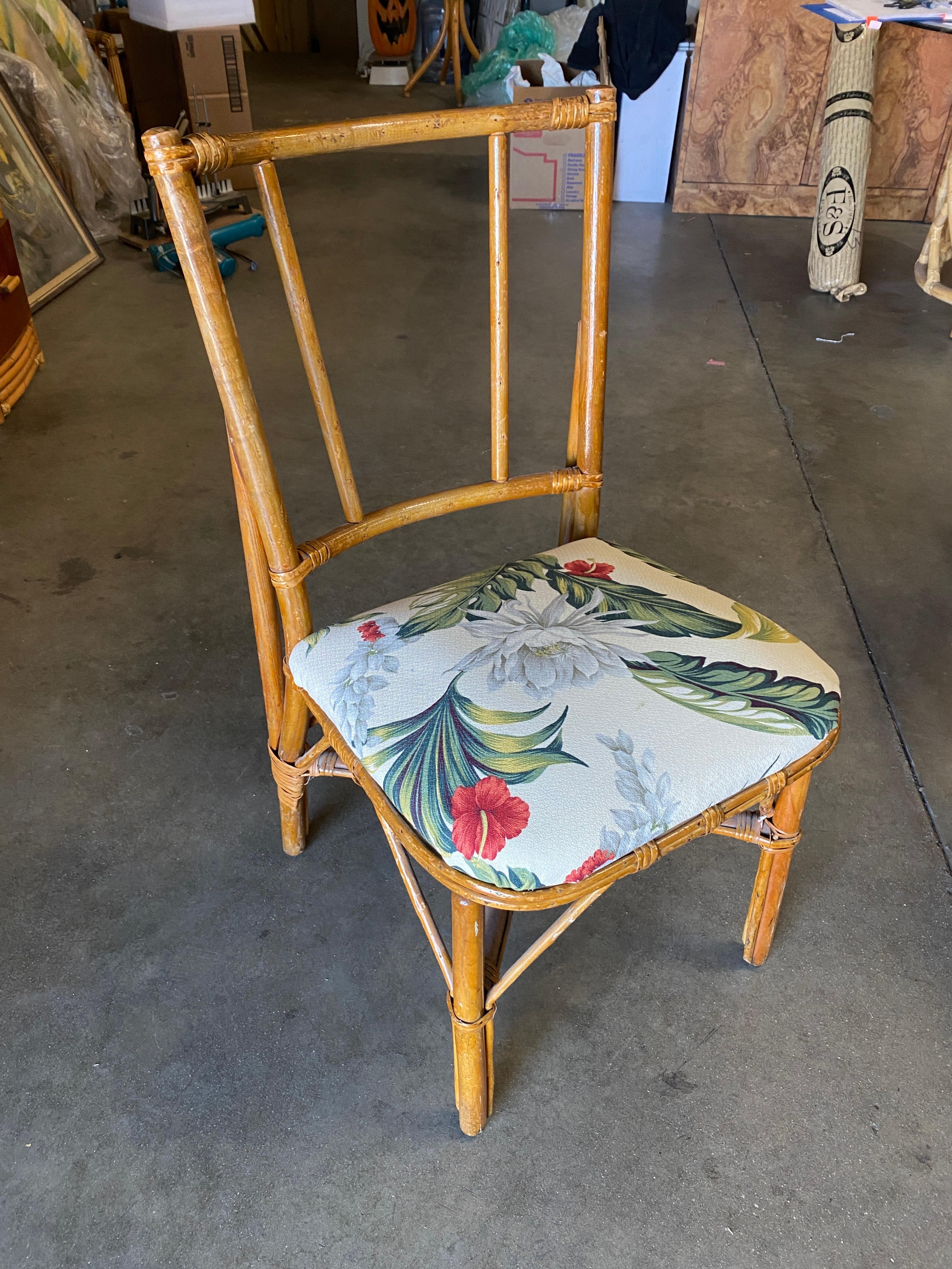 Original mid century mahogany and rattan secretary desk with matching chair. This late 1950s desk features a mahogany top with rattan legs and wicker sides, center drawer and built in top holders.

Desk: H 34 in. x W 16 in. x D 186 in.
Chair: H