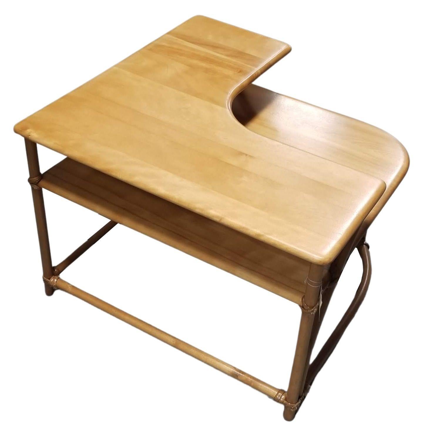 Restored Mid Century Maple corner table by Heywood Wakefield, Featuring Faux Rattan single-strand legs made of sculpted oak. The table features a smooth, natural 
