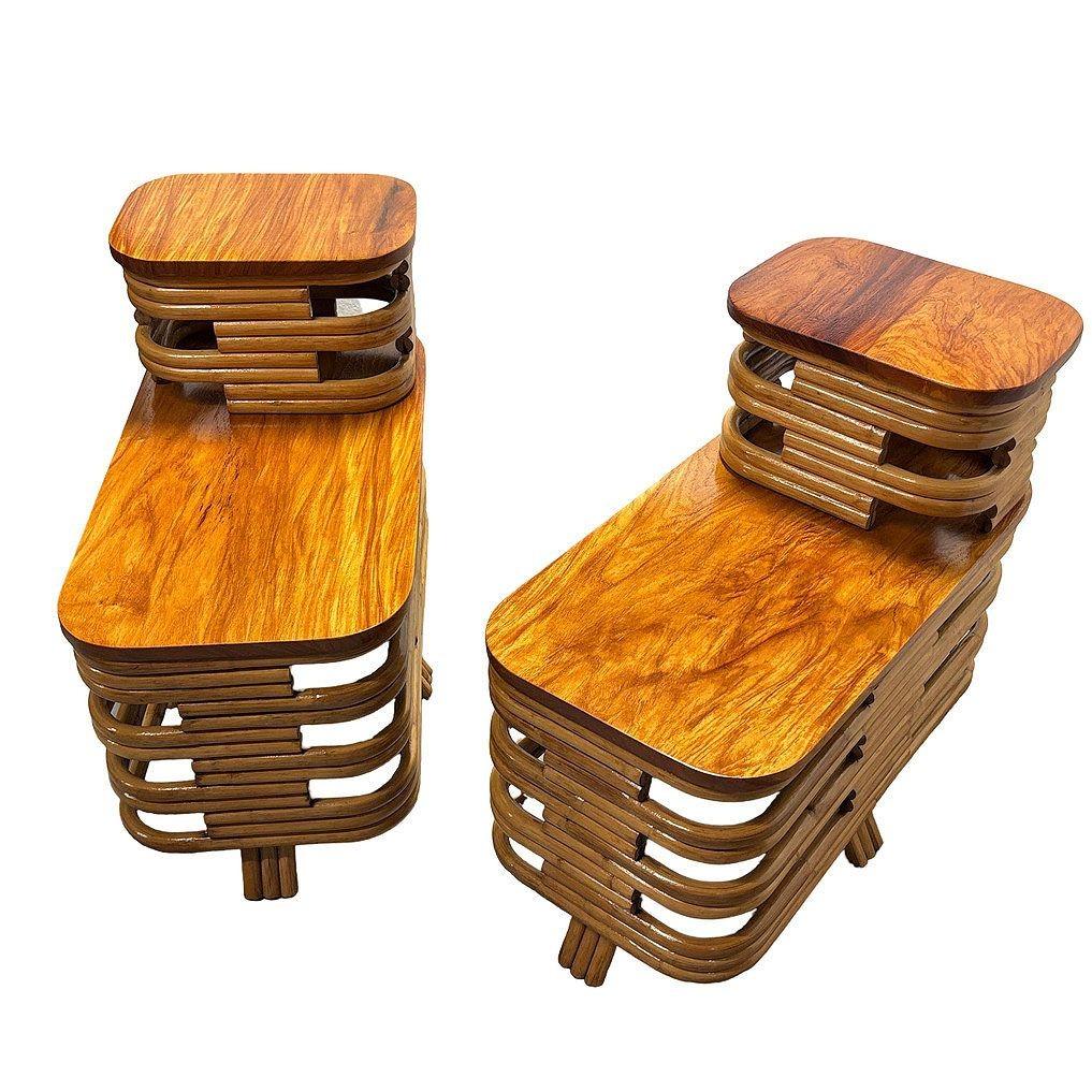 Pair of Mid-century two-tier stacked rattan end tables with cut-out sides, flame mahogany wood tops, and 2-strand rattan feet. These vintage-inspired pieces blend natural texture with rich wood tones, making them a perfect addition to any Modern or