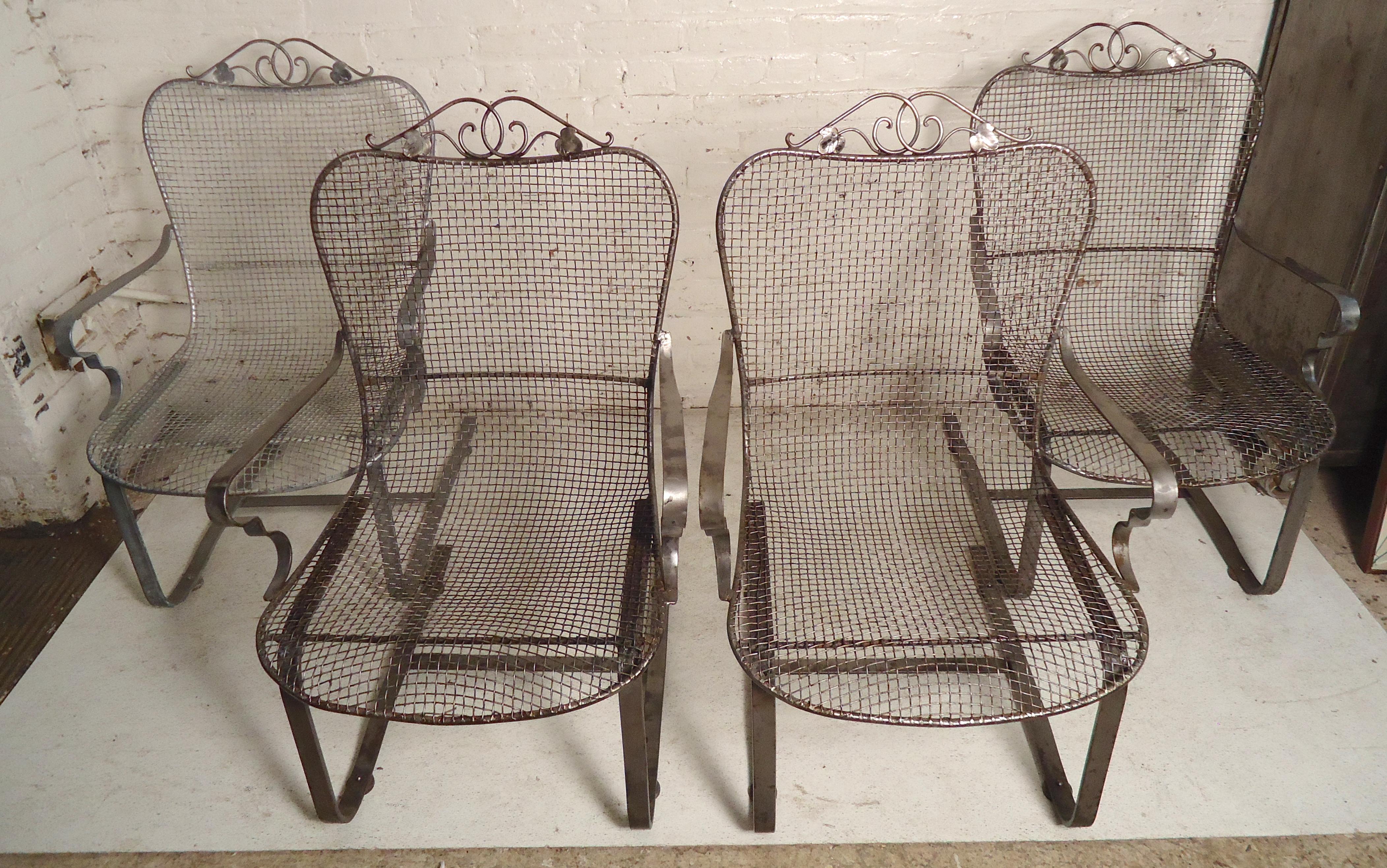 Set of four outdoor chairs with mesh metal seating on strong spring bases. Attractive floral detailing.

(Please confirm item location - NY or NJ - with dealer)
     