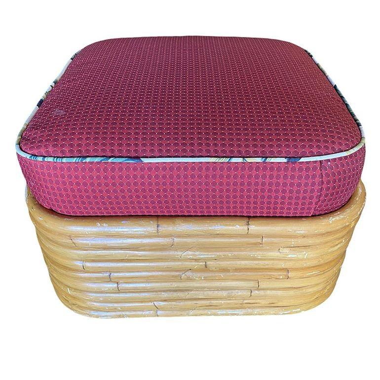 This beautifully restored Paul T. Frankl-inspired rattan ottoman blends style and vintage charm with modern comfort. The Mid-century ottoman features a stacked 9-strand pole base with a cross-section on top for holding the custom cushion. It