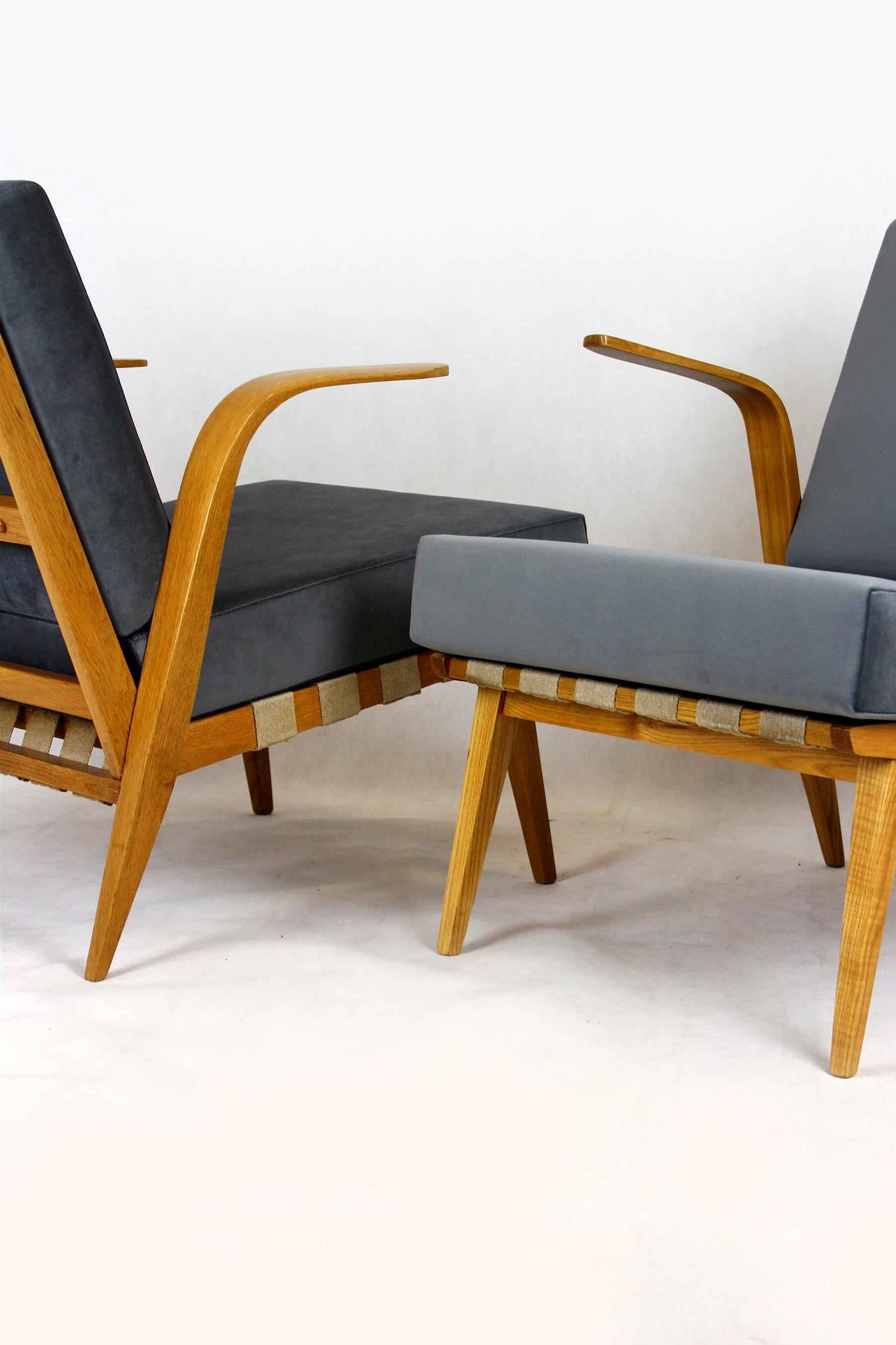 This pair of armchairs was made in 1962 by Drevozpracujici Druzstvo in Czechoslovakia.
The armrests are made of bent wood.
The armchairs have been restored, new mattresses, satin lacquered wood.
The armchairs are slightly different from each