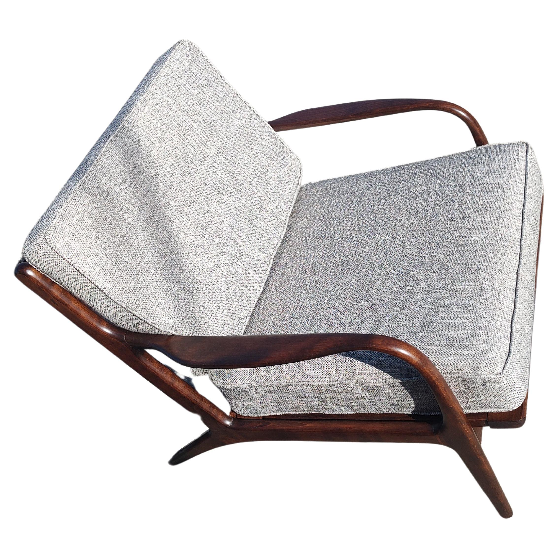 Totally restored Mid century lounge chair with adjustable ottoman foot rest attributed to Ib Kofod-Larsen. All new fabric with new foam on both pieces. Vintage retro looking fabric is a beautiful silvery grey in color. Ottoman is 19.5 x 21 x 15.5h
