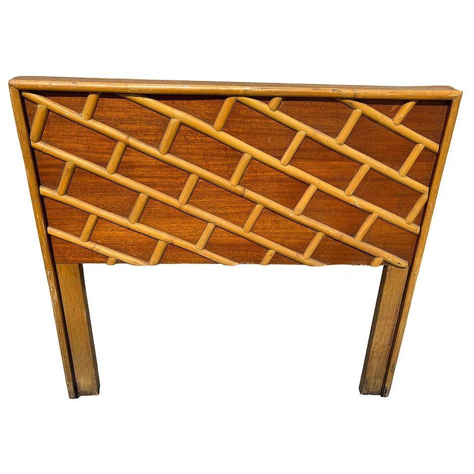 This restored Mid-century rattan and mahogany twin-size bed headboard blends natural materials with an elegant design. The rattan frame features rattan poles in a geometric brick wall pattern, complemented by the rich, polished mahogany backboard