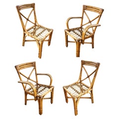 Ensemble de 4 chaises de salle à manger en rotin du milieu du siècle, restaurées, à accoudoir en boucle, avec dossier en X