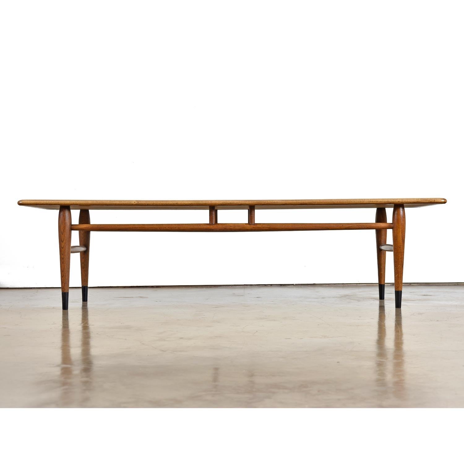 The Lane Acclaim collection has become an American Mid-Century Modern Classic. The two-tone oak on walnut with exaggerated dove-tail design has become sought after by collectors nationwide. Produced for over ten years between the 1960s and early