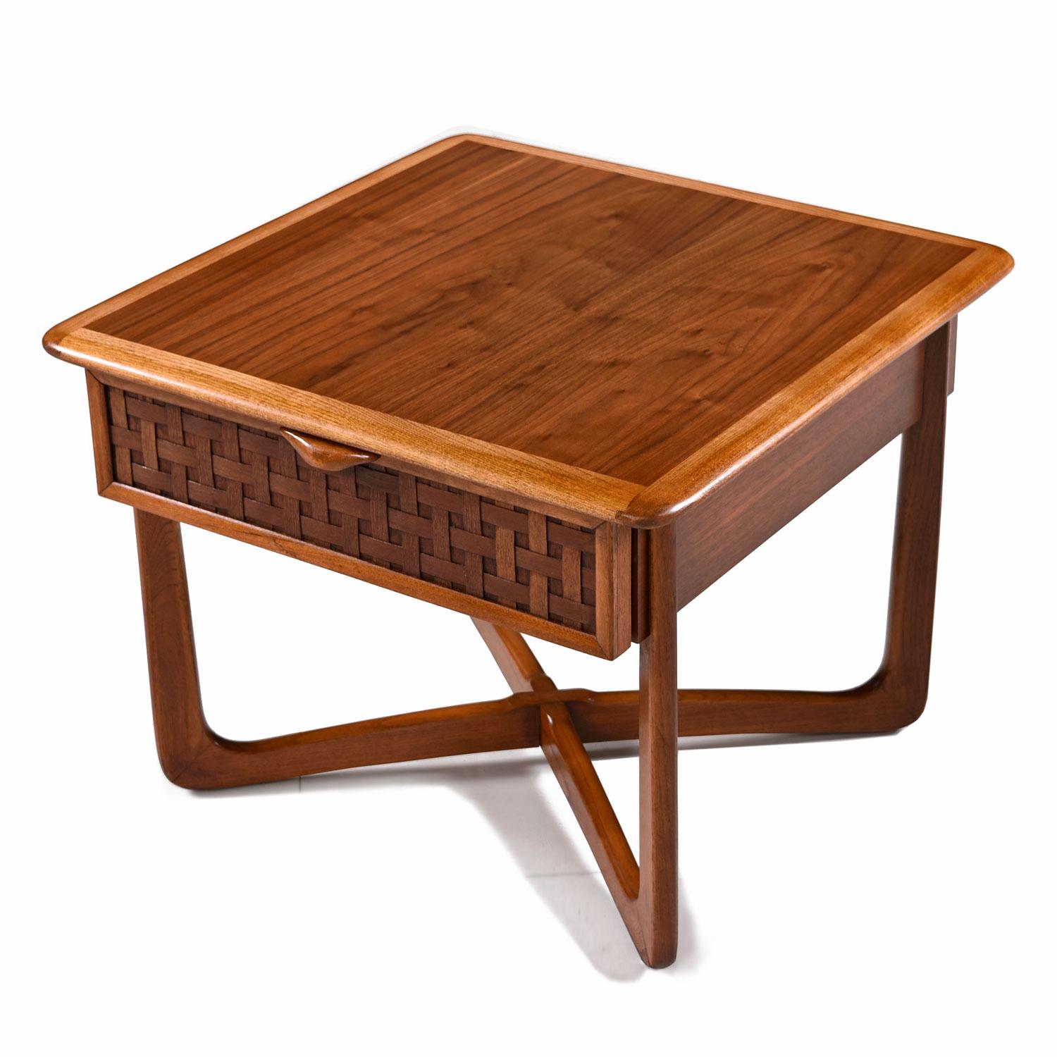 (2) available, each sold separately. Mid-Century Modern Lane Perception lamp table. Quality American construction paired with Fine design. Top surface is walnut wood with contrasting oak trim tracing the perimeter. Elegant woven wood facade and