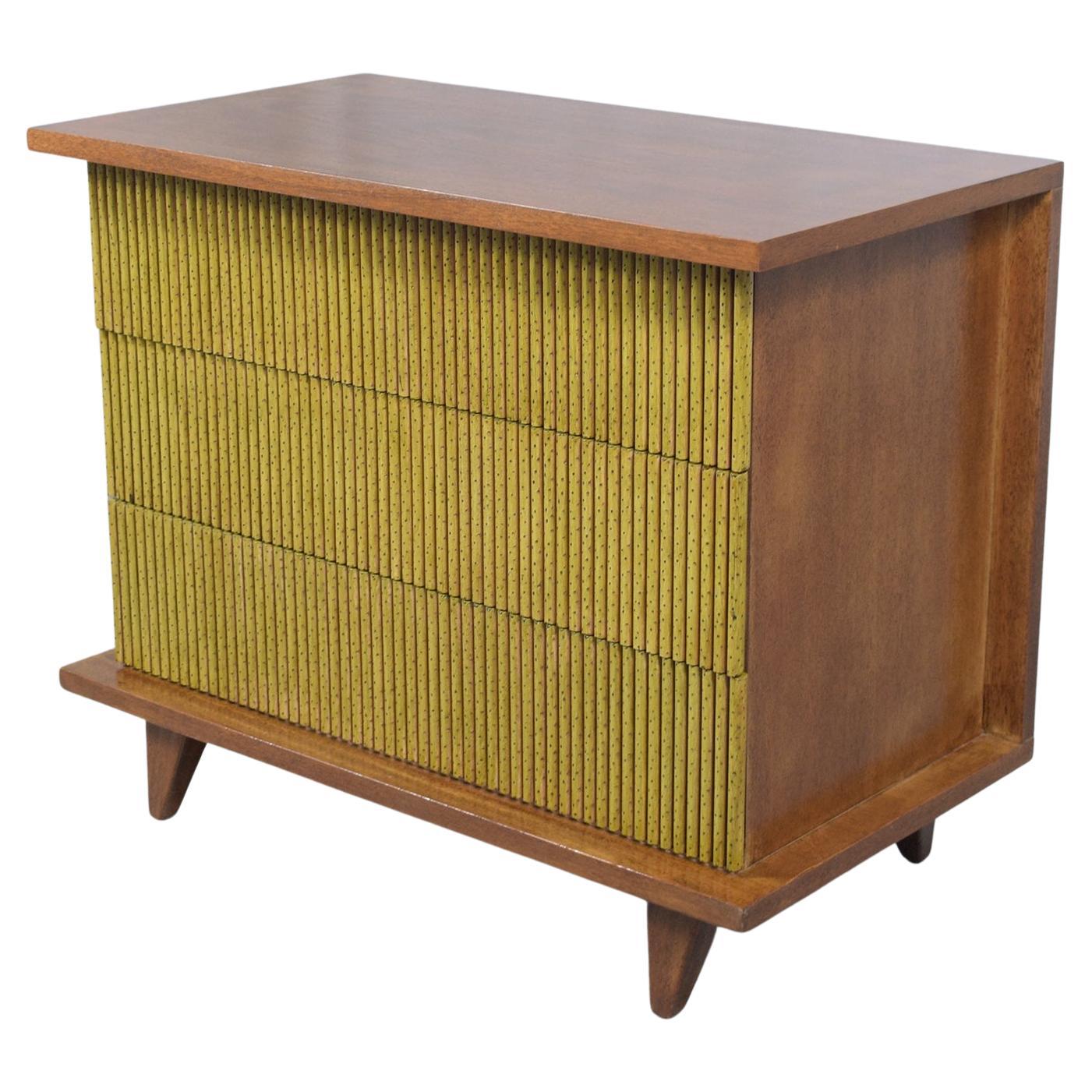 Step into the world of mid-century elegance with our beautifully restored chest of drawers, a testament to the timeless design and craftsmanship of the era. This exquisite piece, intricately crafted from high-quality mahogany wood, has been given