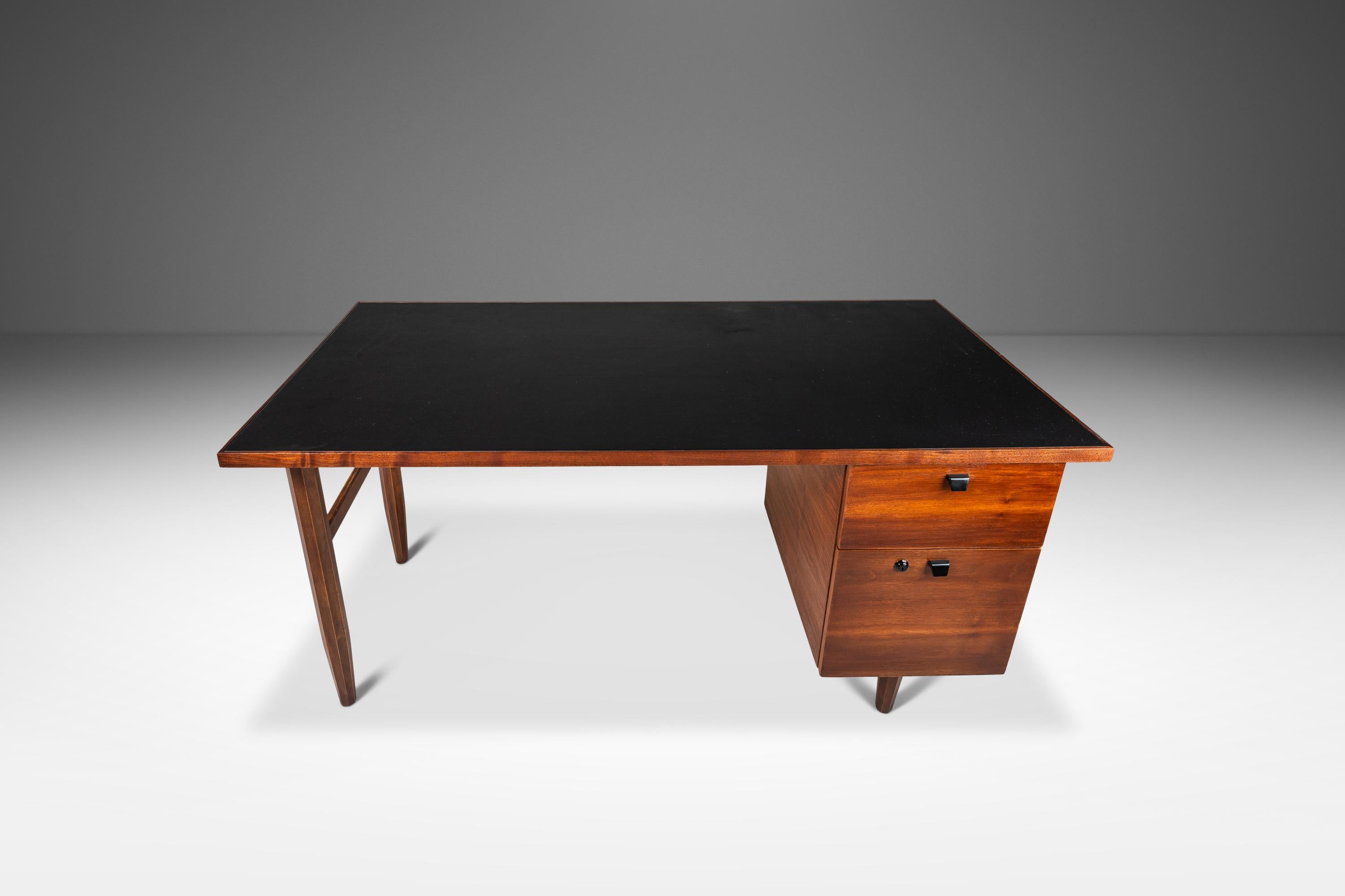  Introducing an extraordinary writer's desk fresh out of our restoration shop. Originally built in the 1960's this minimalist desk has undergone a comprehensive and transformative restoration process that features a genuine leather desk top as well