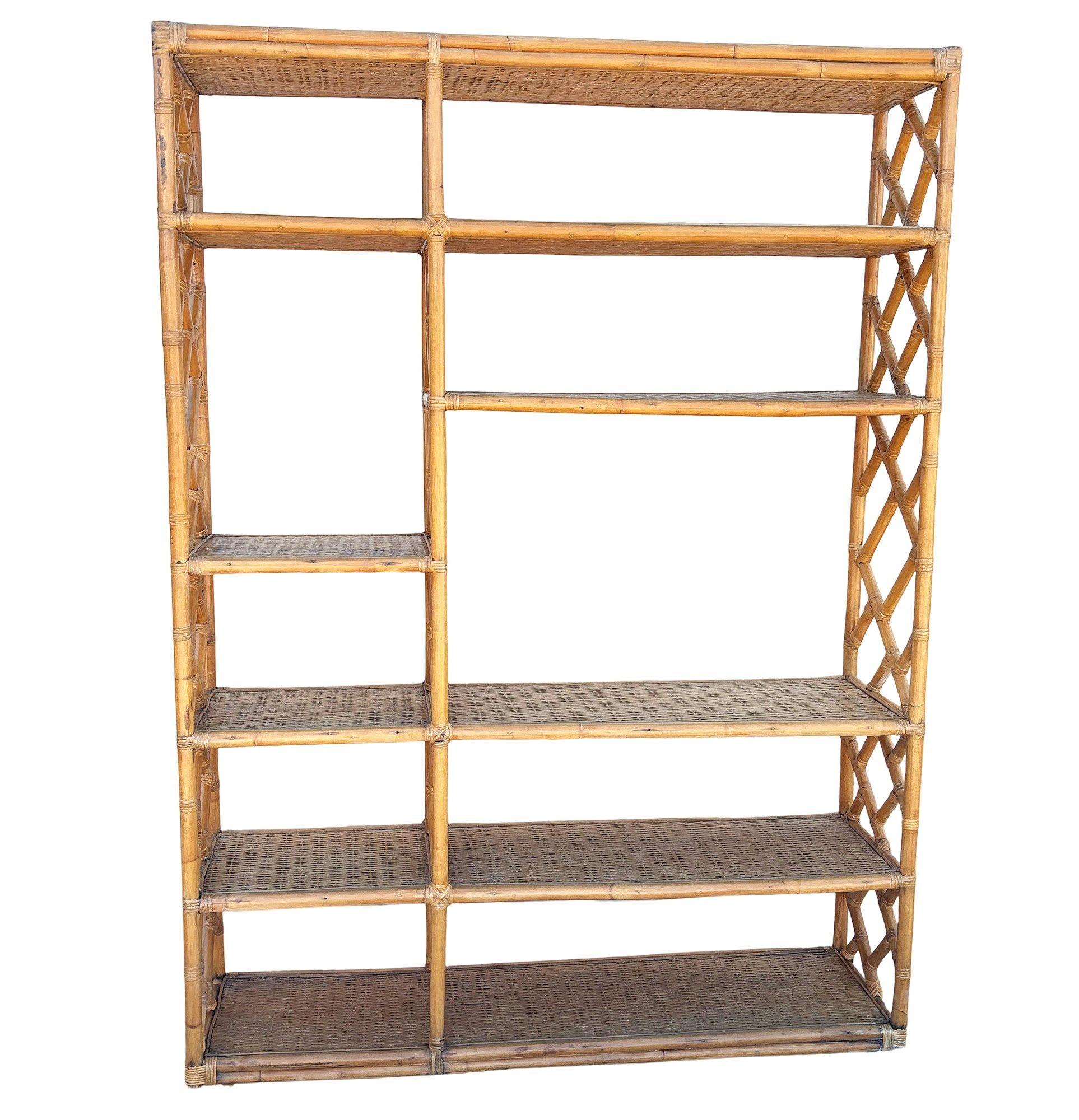 Beautifully restored Ten-level rattan shelf room divider wall with woven wicker shelving. The unit features a unique broken-up ten-level shelf design with a modernist 