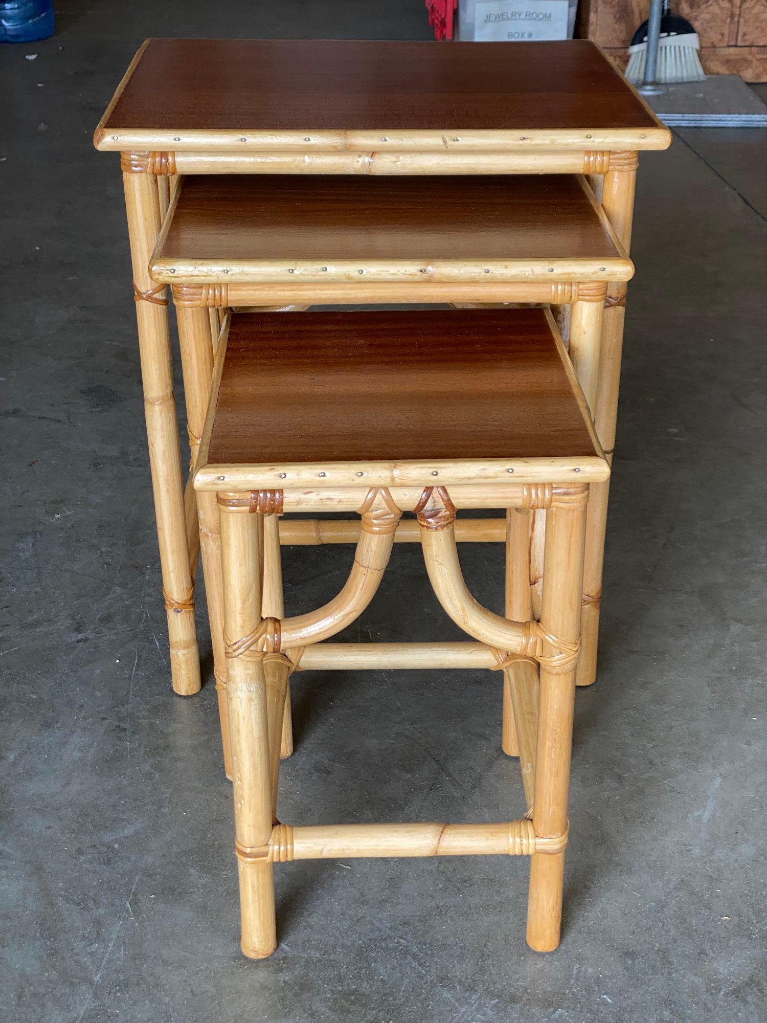Restored Mid-Century Set of 3 Rattan Nesting Side Tables with Mahogany Top In Excellent Condition For Sale In Van Nuys, CA