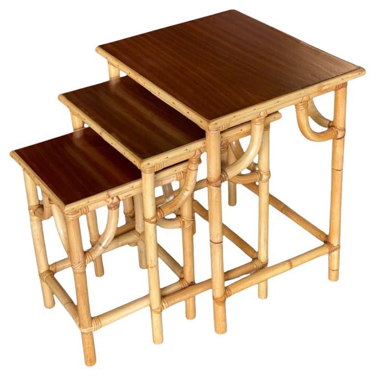 Restored Mid-Century Set of 3 Rattan Nesting Side Tables with Mahogany Top For Sale